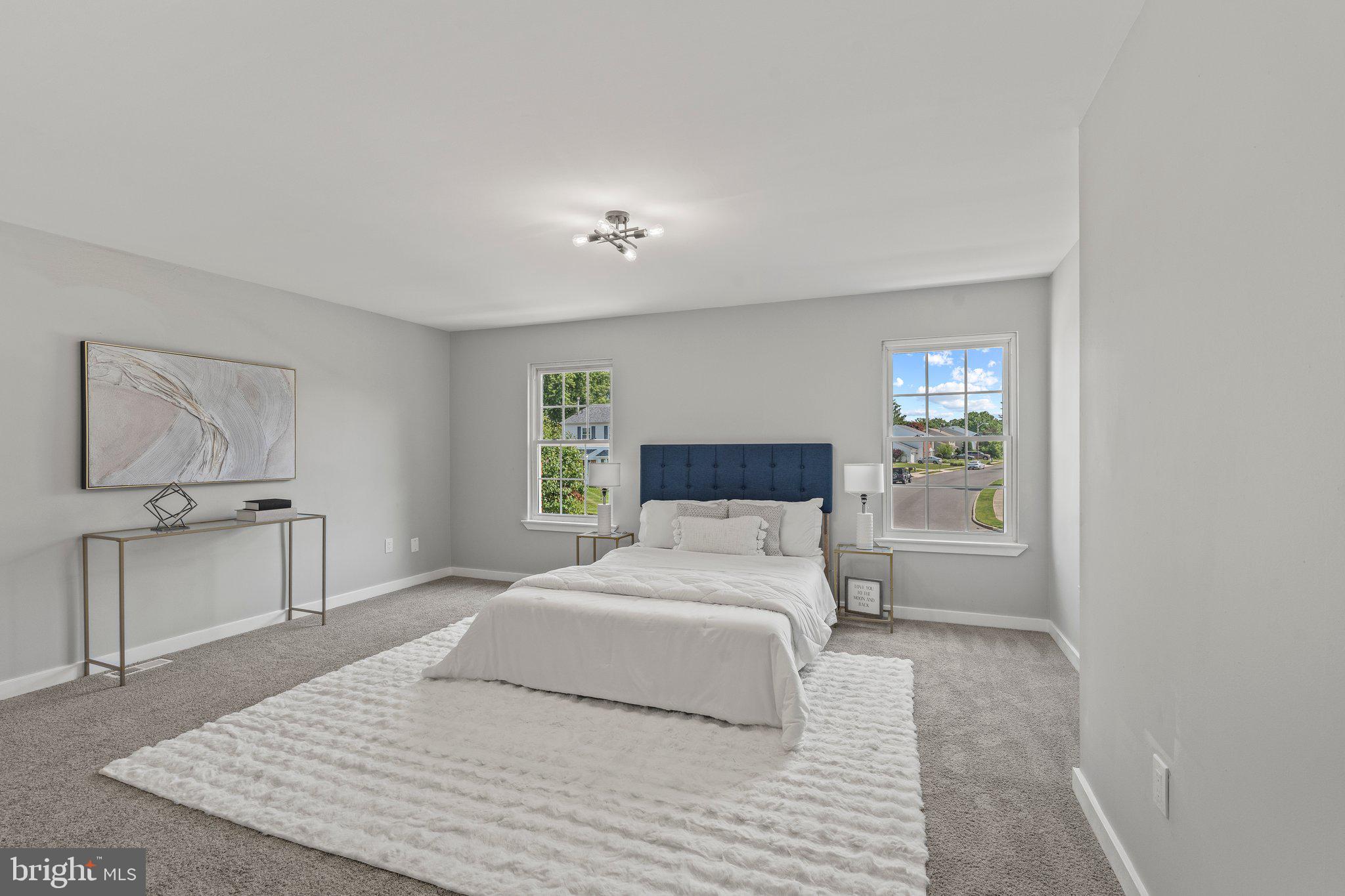 71 Borrelly Boulevard Sewell, NJ 08080 - Photo 16 of 39 a bedroom with a large bed and wooden floor