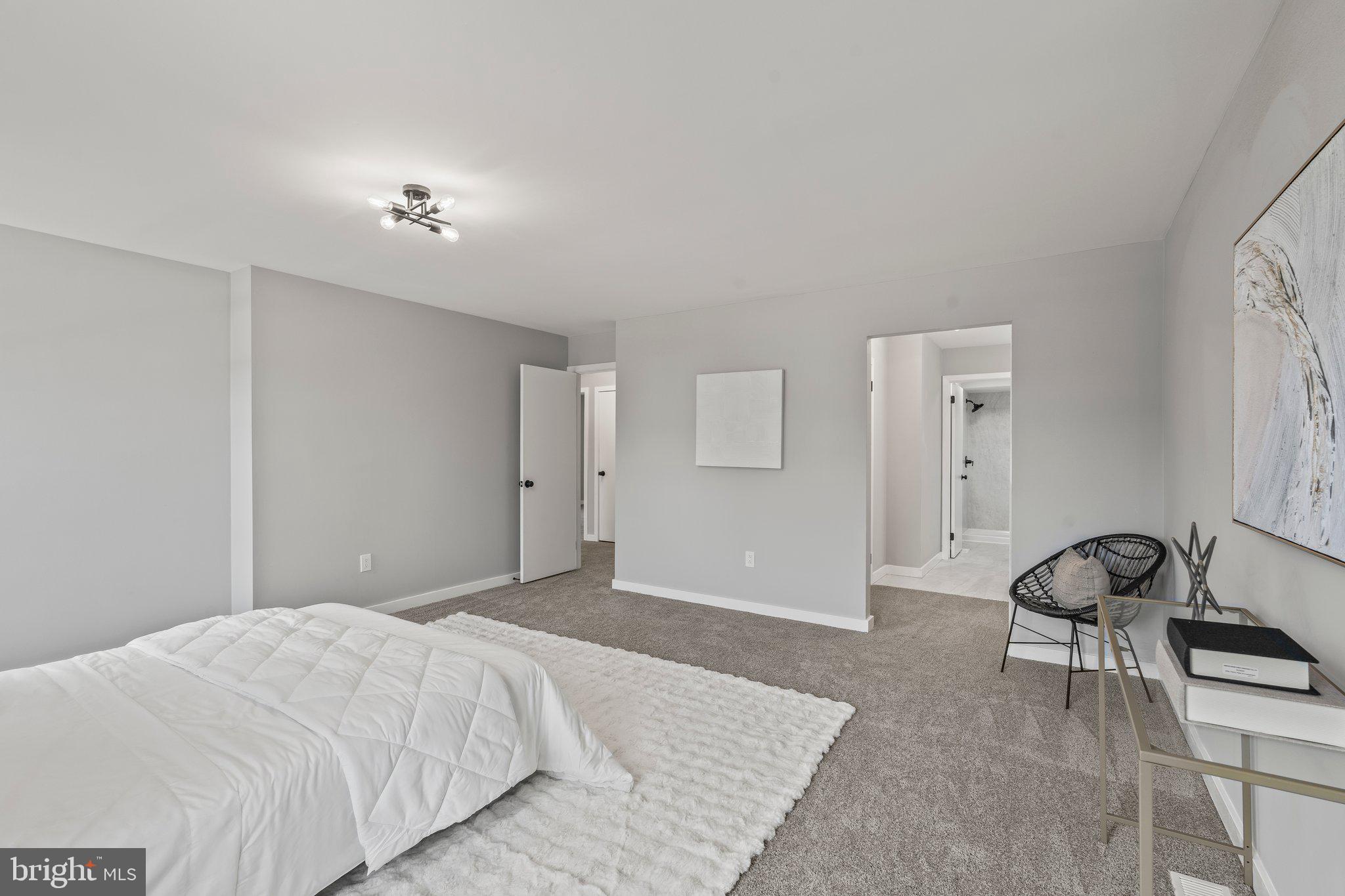 71 Borrelly Boulevard Sewell, NJ 08080 - Photo 17 of 39 a bedroom with a bed and a chair