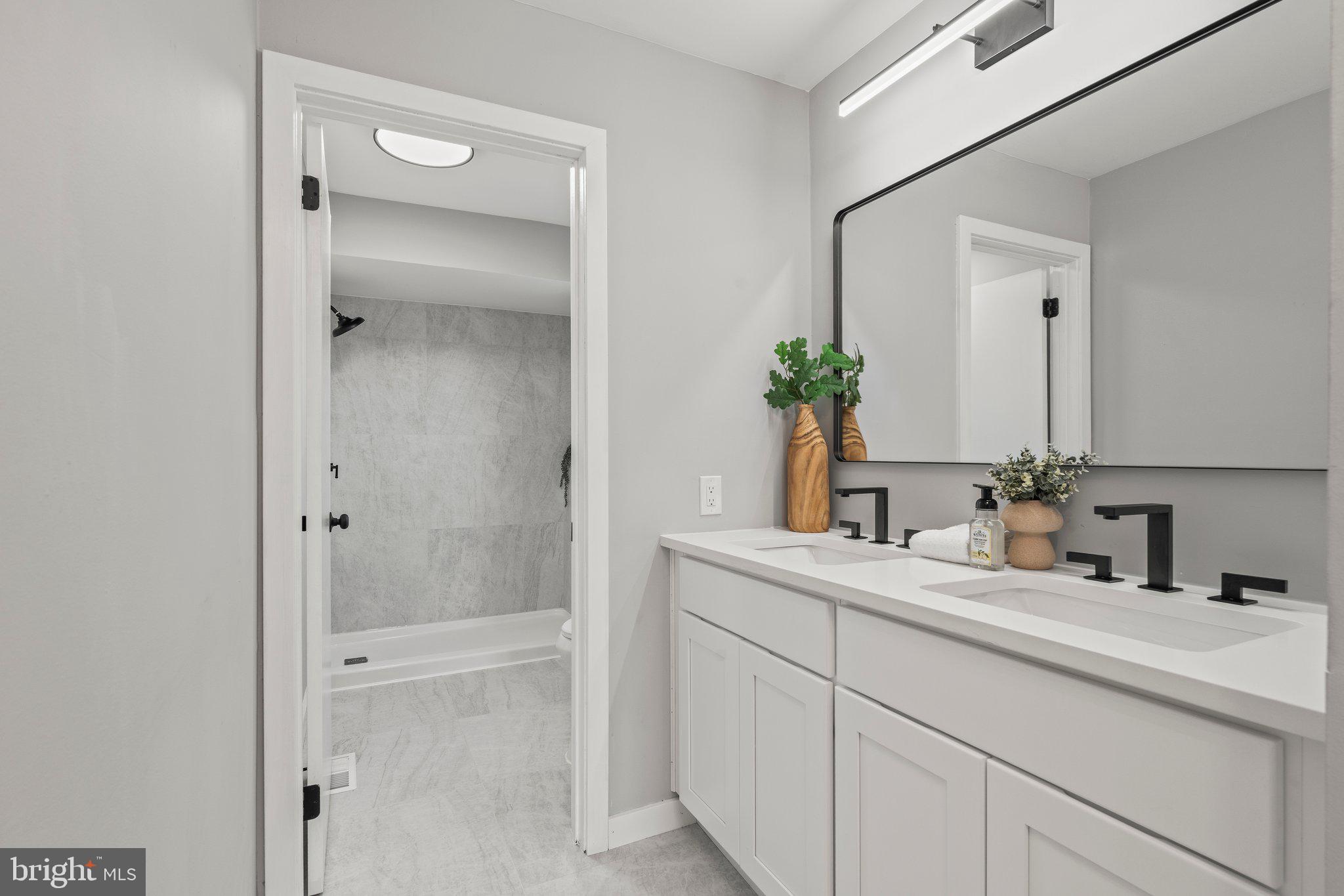 71 Borrelly Boulevard Sewell, NJ 08080 - Photo 19 of 39 a bathroom with a double vanity sink mirror and shower