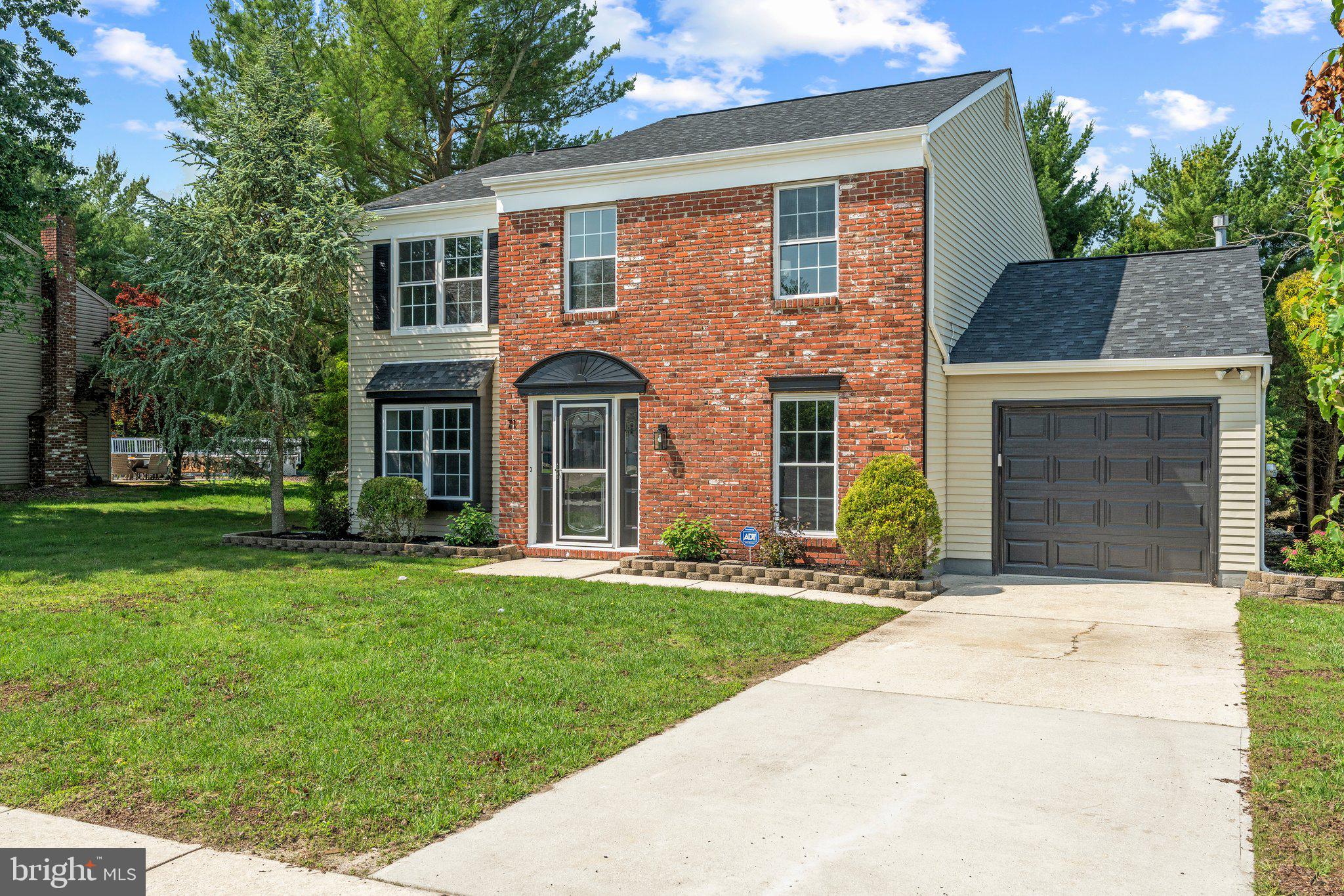 71 Borrelly Boulevard Sewell, NJ 08080 - Photo 2 of 39 front view of a brick house next to a yard