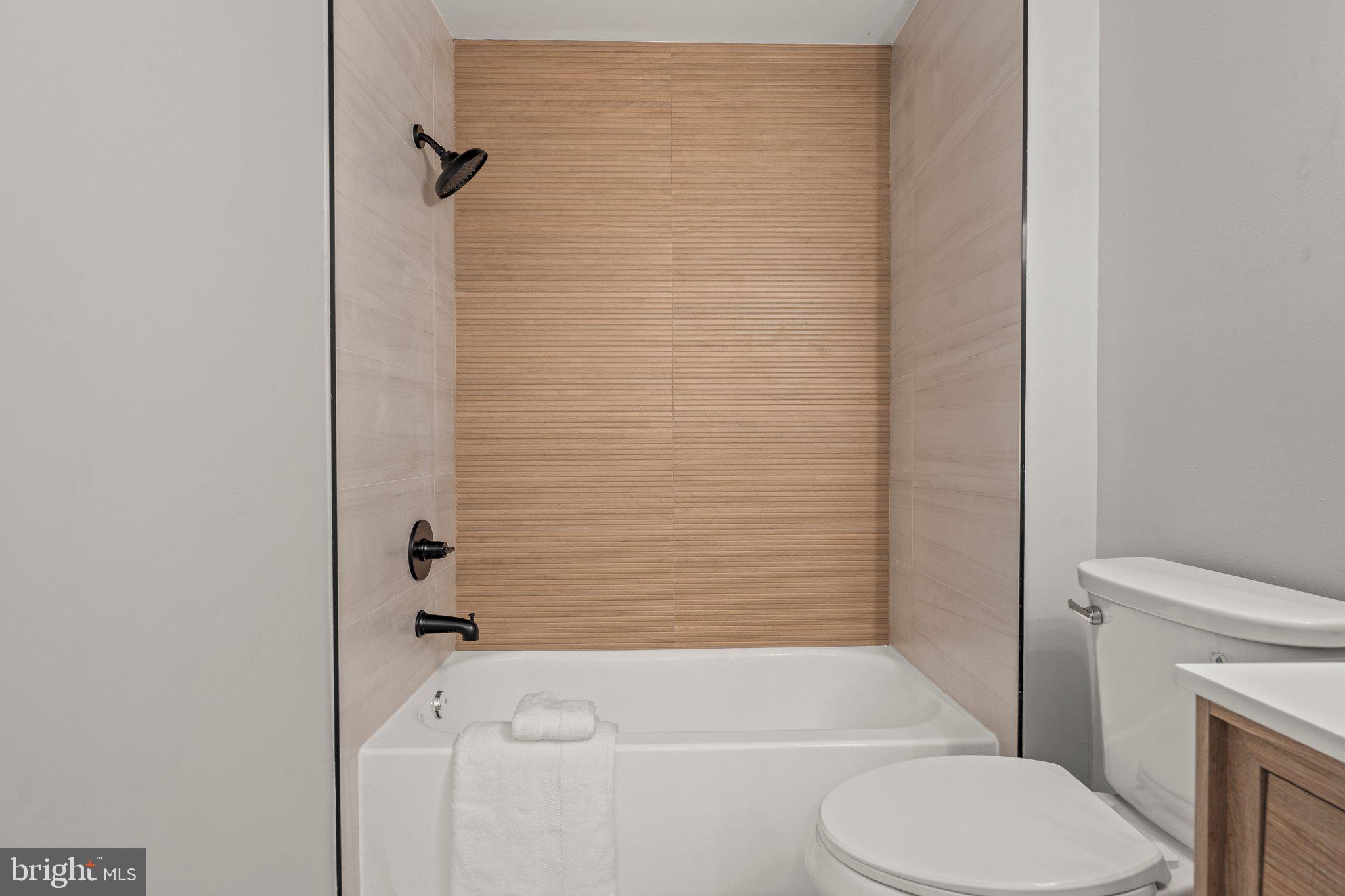 71 Borrelly Boulevard Sewell, NJ 08080 - Photo 23 of 39 a bathroom with a toilet and a bath tub