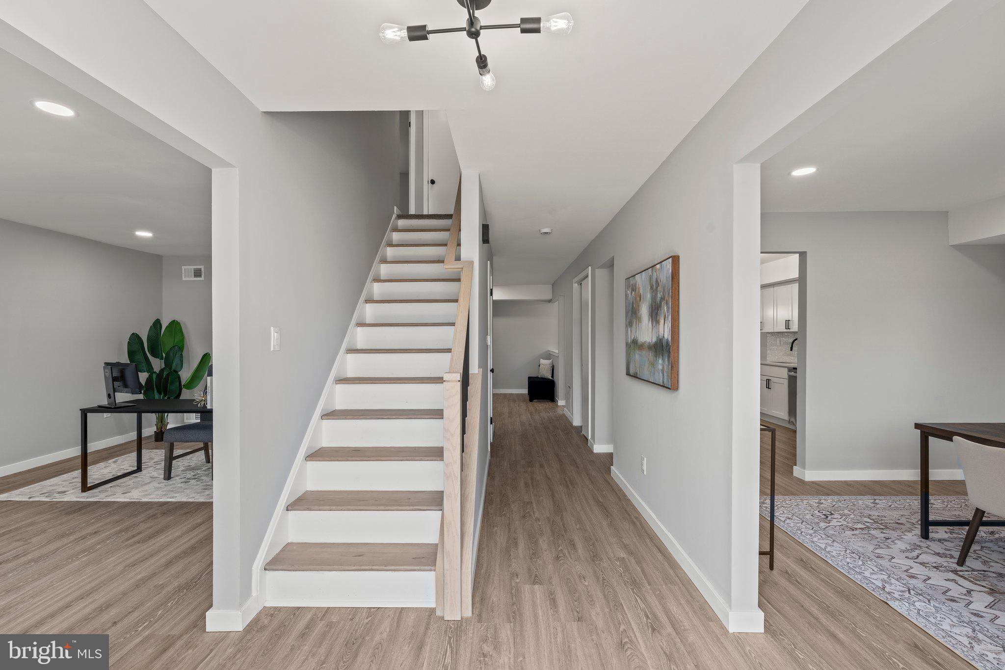 71 Borrelly Boulevard Sewell, NJ 08080 - Photo 3 of 39 a view of entryway and hall with wooden floor