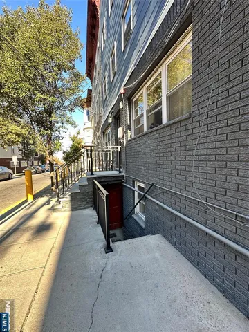 a swimming pool with outdoor seating and yard