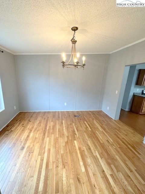 68 Rhoneys View Road Newland, NC 28657 - Photo 21 of 37 a bedroom with a bed window and a chandelier