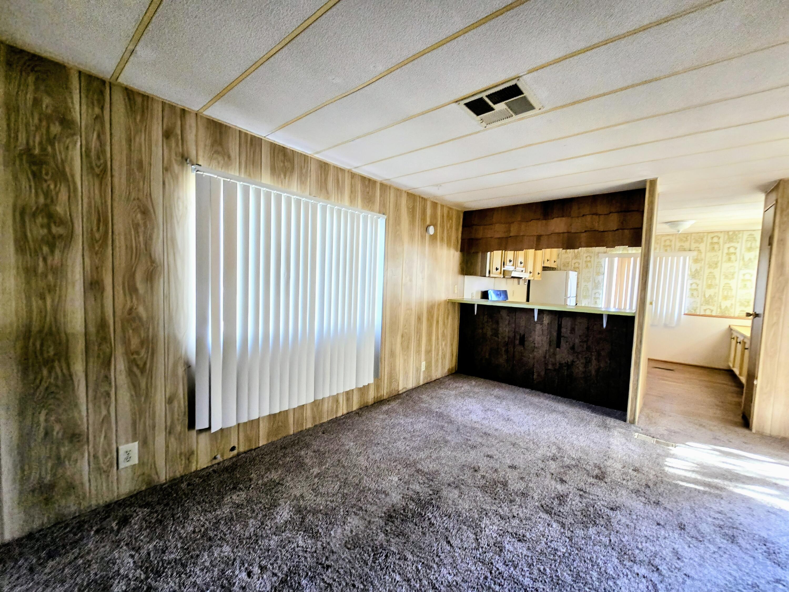 34220 Cheseboro Road Palmdale, CA 93552 - Photo 11 of 12 a view of an empty room with a window