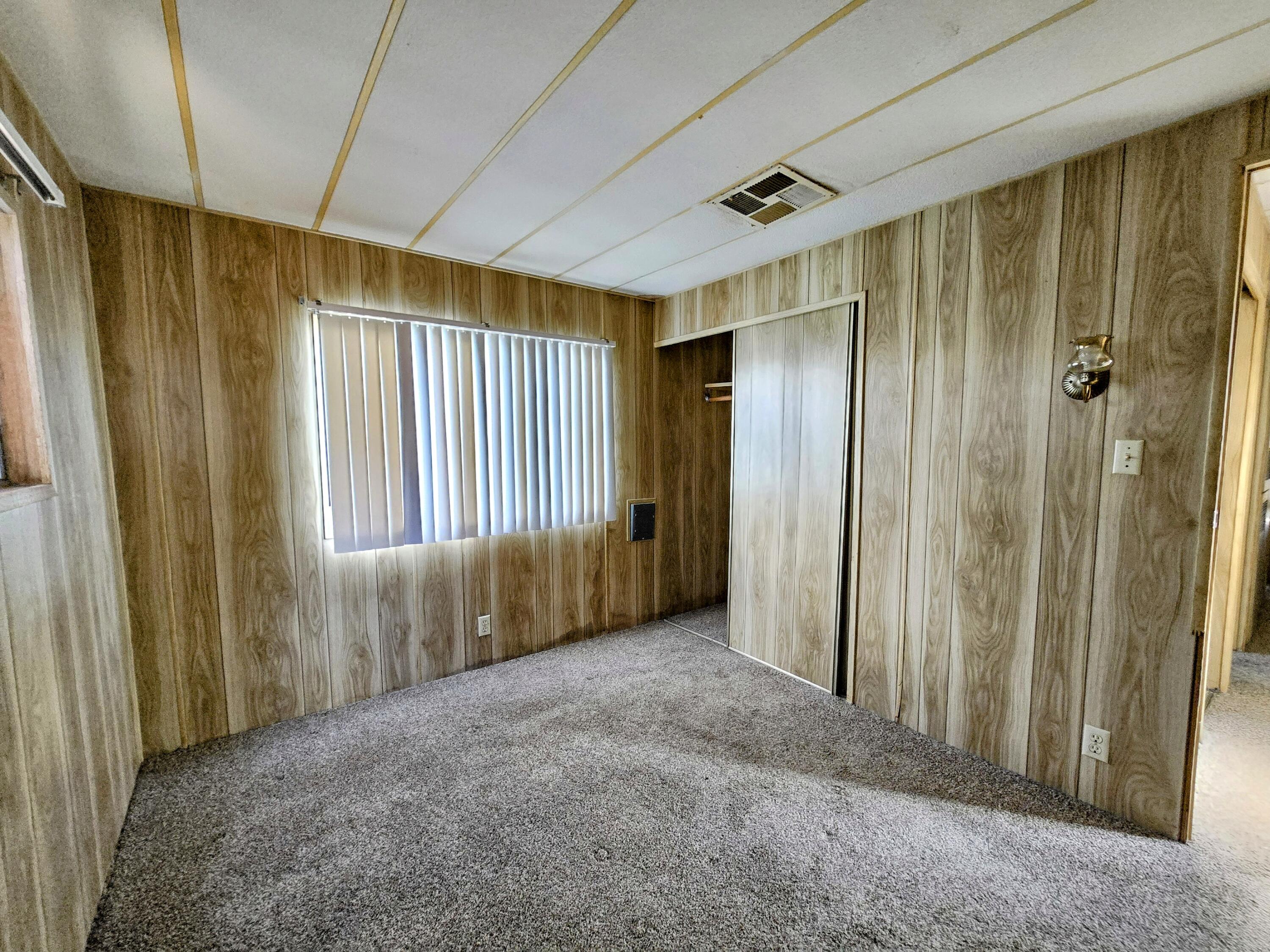 34220 Cheseboro Road Palmdale, CA 93552 - Photo 5 of 12 a view of entryway with wooden walls
