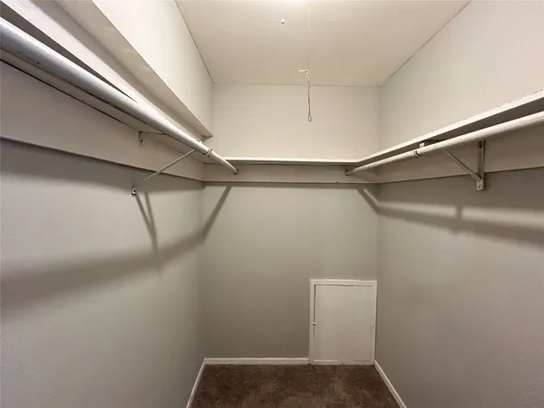 a view of a room with racks on the wall