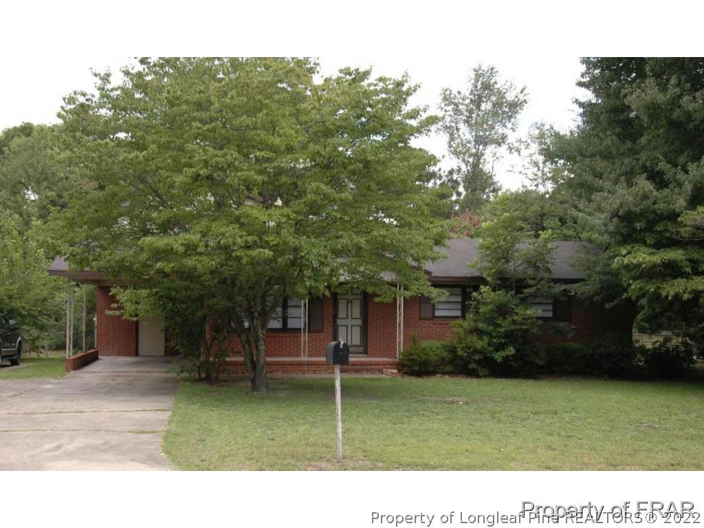 1413 Hibiscus Road Fayetteville, NC 28311 - Photo 1 of 10 a view of a house with a backyard