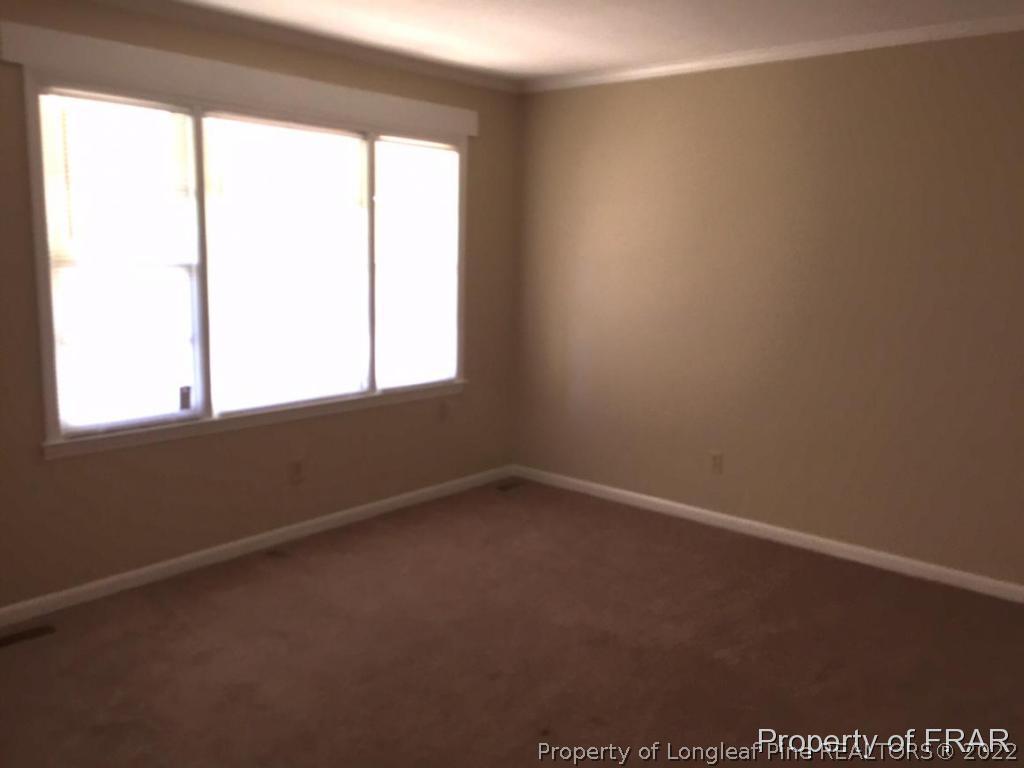 1413 Hibiscus Road Fayetteville, NC 28311 - Photo 2 of 10 an empty room with a window