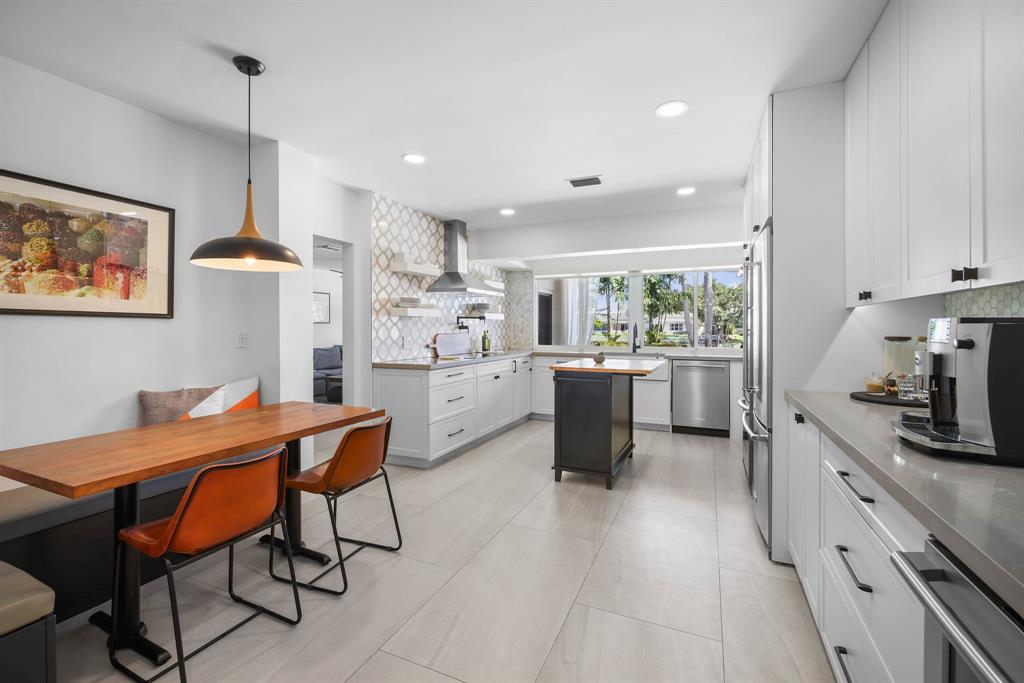 3161 North 36th Street Hollywood, FL 33021 - Photo 15 of 70 a kitchen with stainless steel appliances kitchen island granite countertop a sink and cabinets