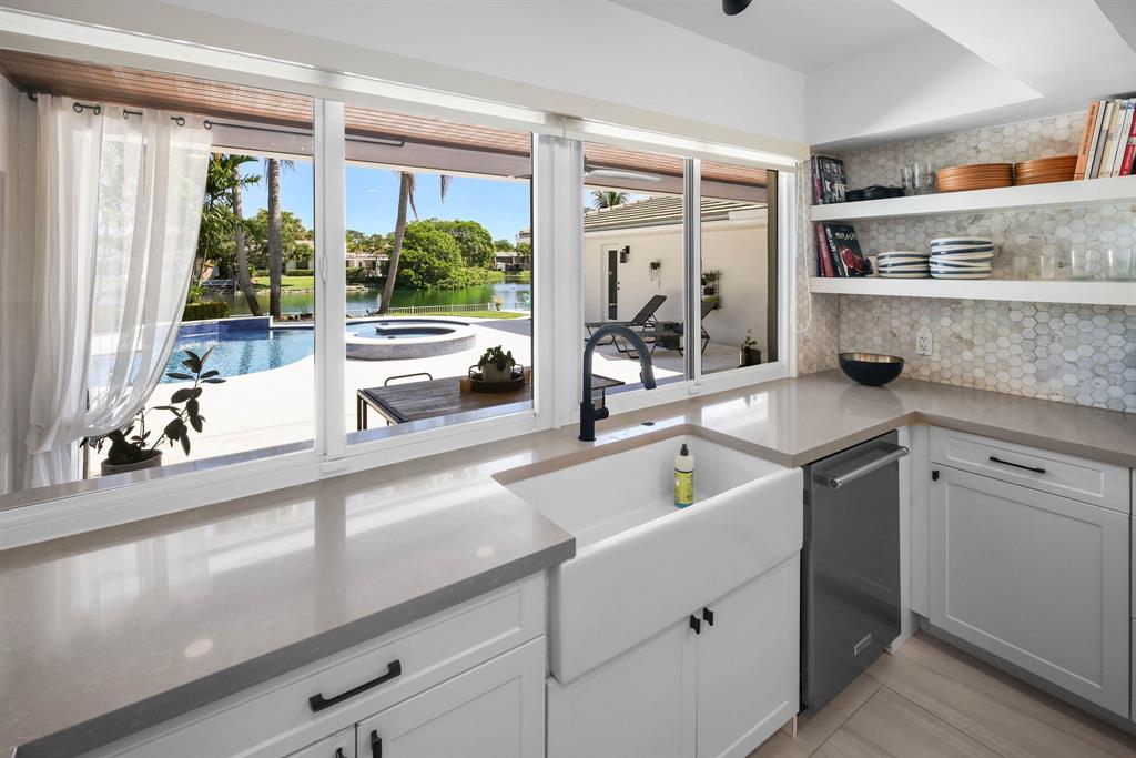 3161 North 36th Street Hollywood, FL 33021 - Photo 18 of 70 a very nice looking room with a large window and white wooden cabinets