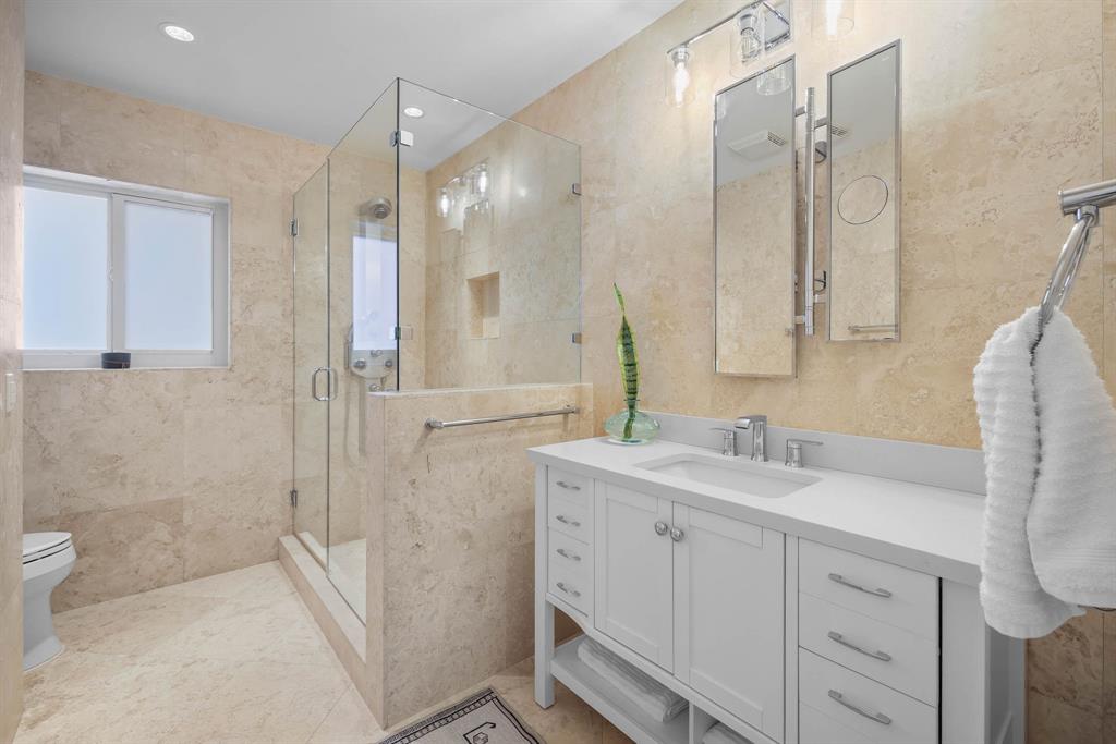 3161 North 36th Street Hollywood, FL 33021 - Photo 47 of 70 a bathroom with a double vanity sink mirror double and shower