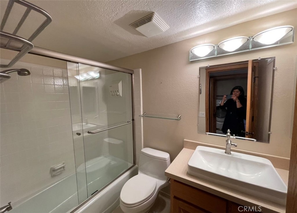 8 Solana, Unit 36 Irvine, CA 92612 - Photo 20 of 22 a bathroom with a sink a toilet and shower