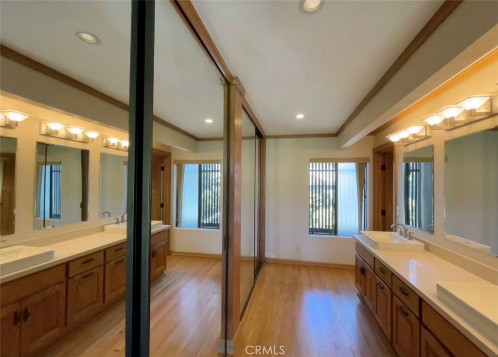 8 Solana, Unit 36 Irvine, CA 92612 - Photo 4 of 22 a bathroom with a sink and a large mirror