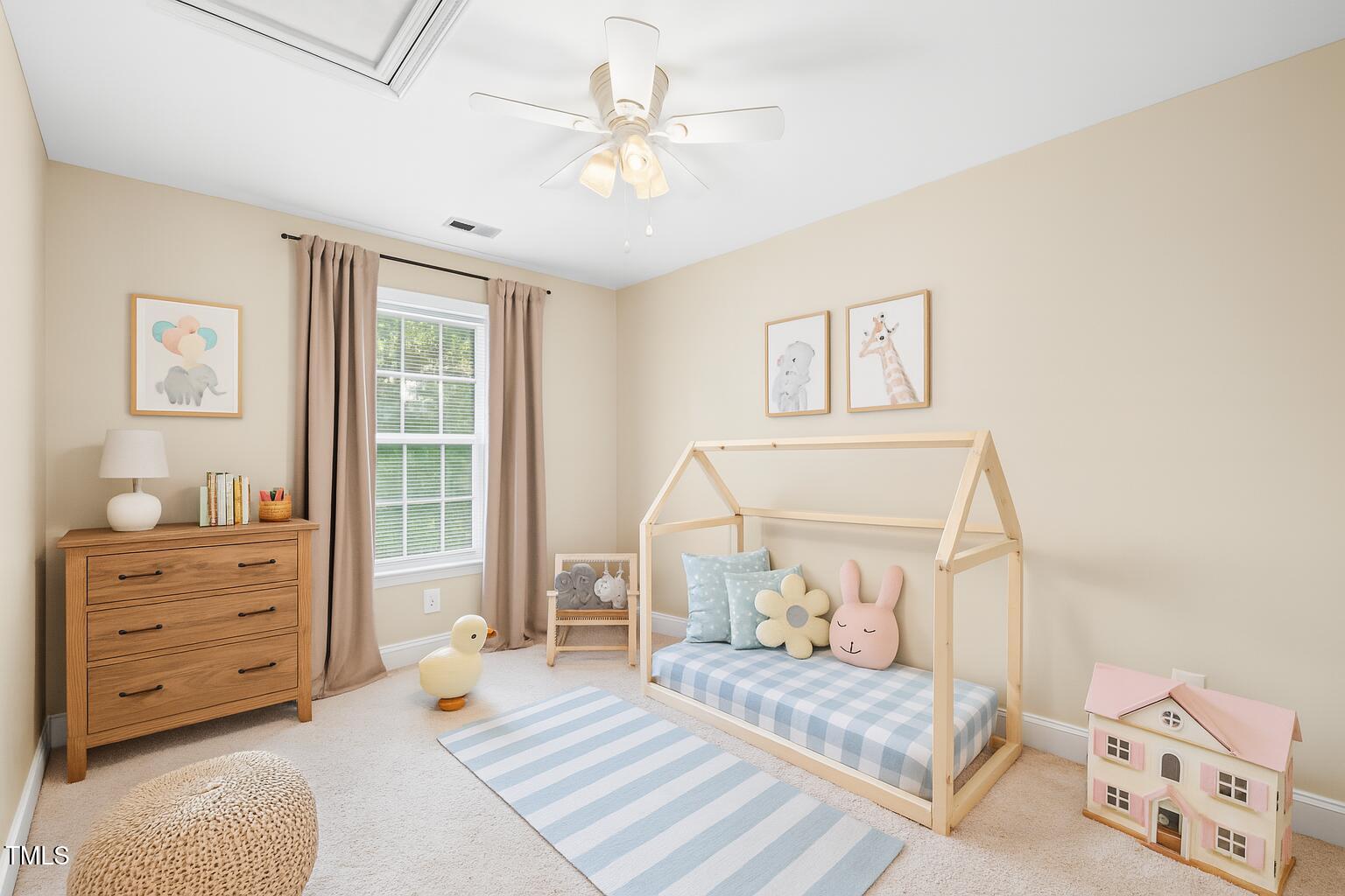 2430 Josephine Road Garner, NC 27529 - Photo 34 of 48 a bedroom with a large bed and a window