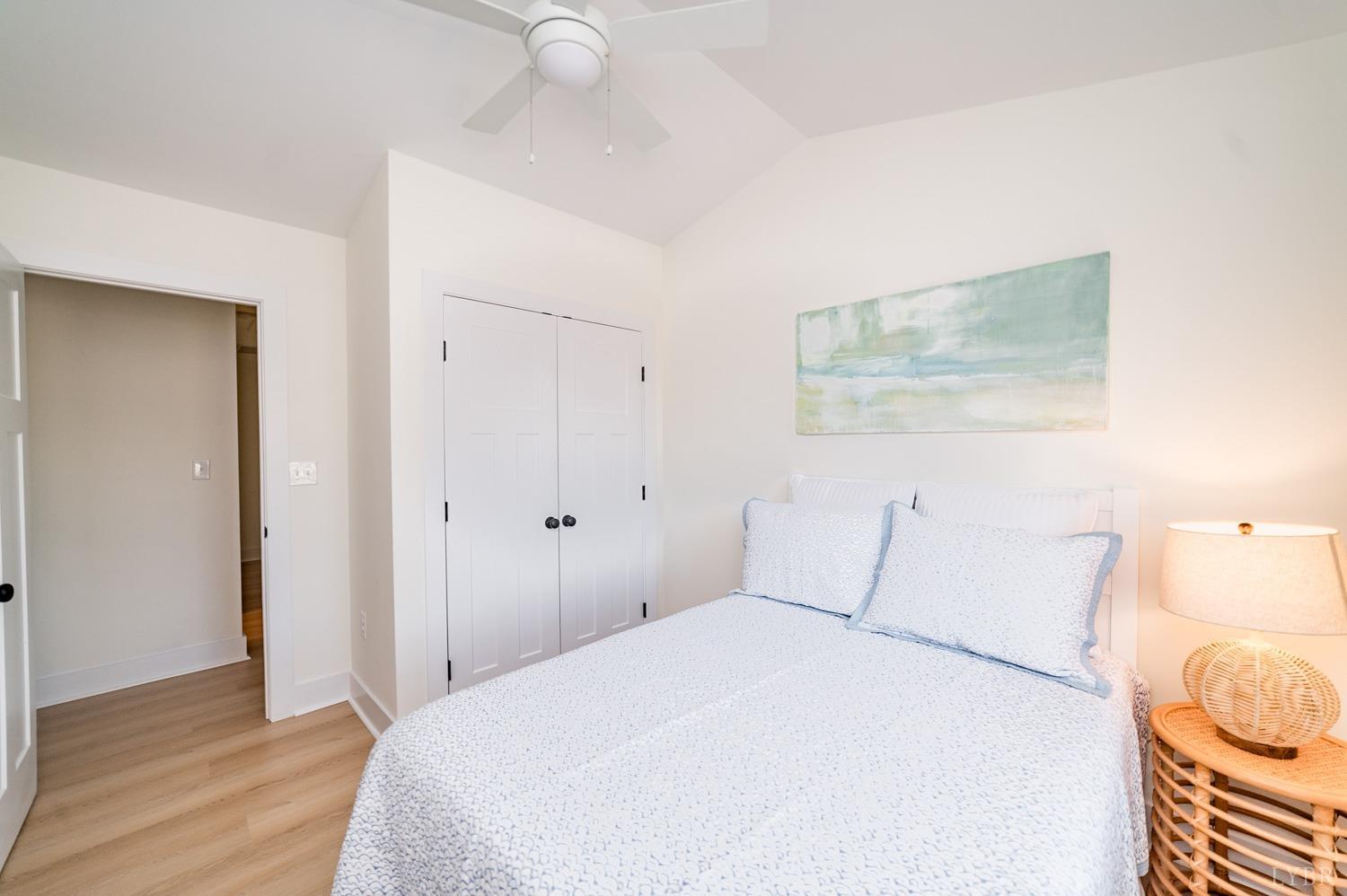 556 Leesville Road, Unit 905 Lynchburg, VA 24502 - Photo 34 of 40 a bedroom with a bed and wooden floor