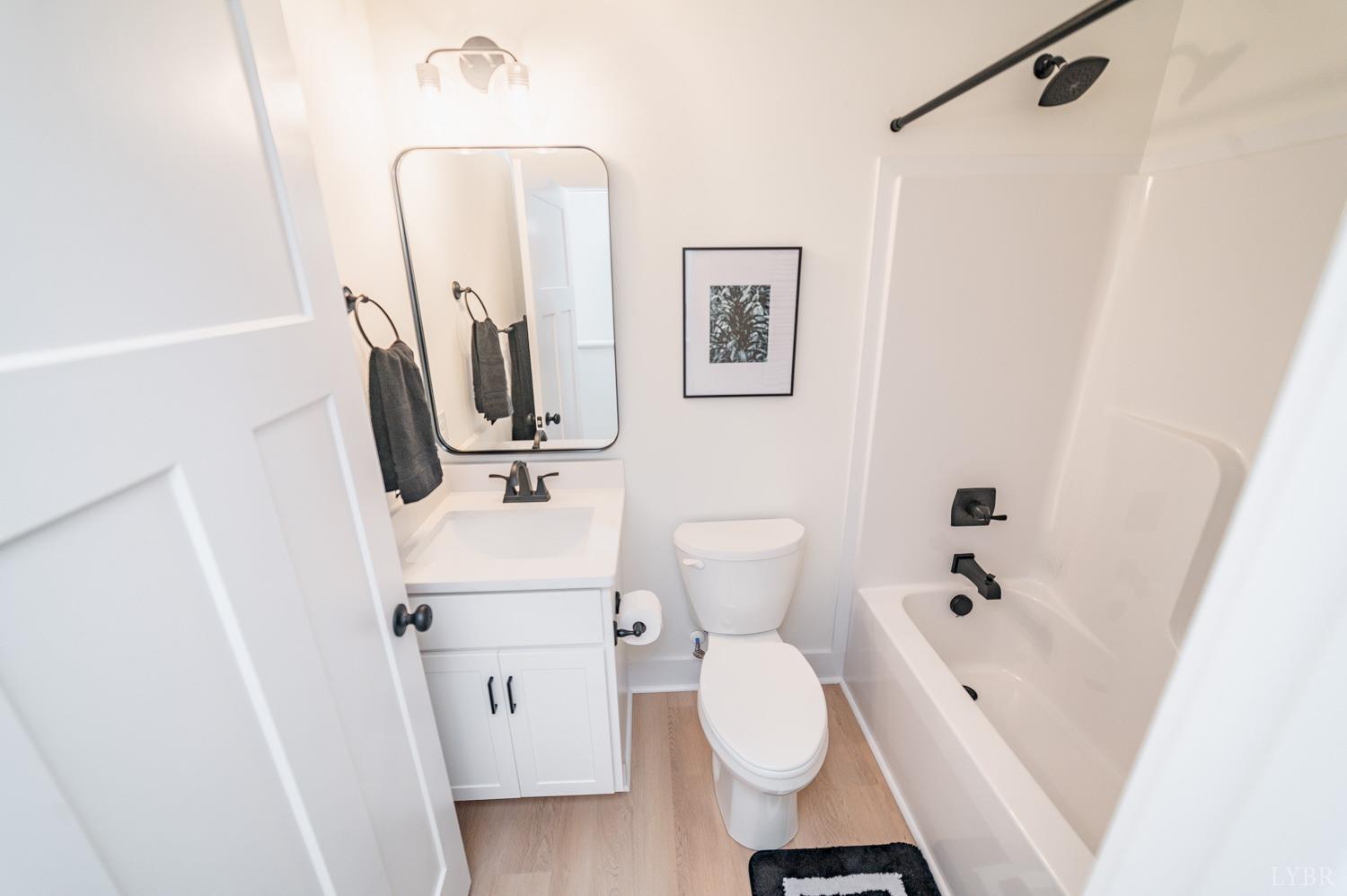 556 Leesville Road, Unit 905 Lynchburg, VA 24502 - Photo 36 of 40 a bathroom with a sink a toilet and shower