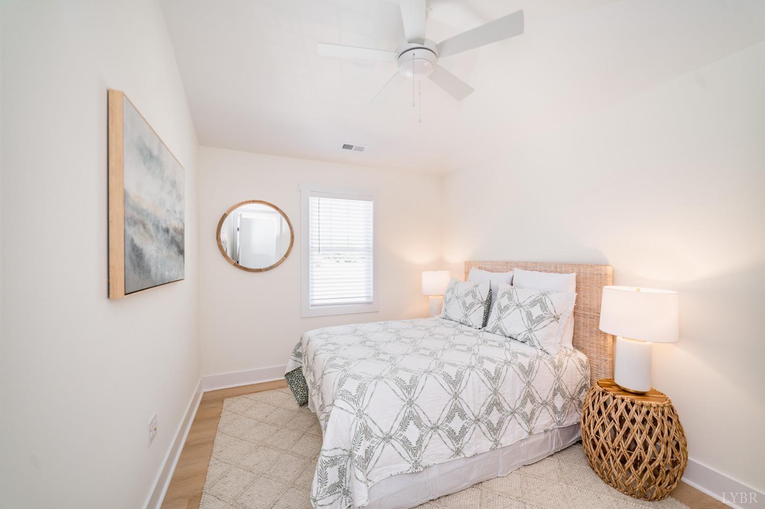 556 Leesville Road, Unit 905 Lynchburg, VA 24502 - Photo 38 of 40 a bedroom with a bed and a chandelier