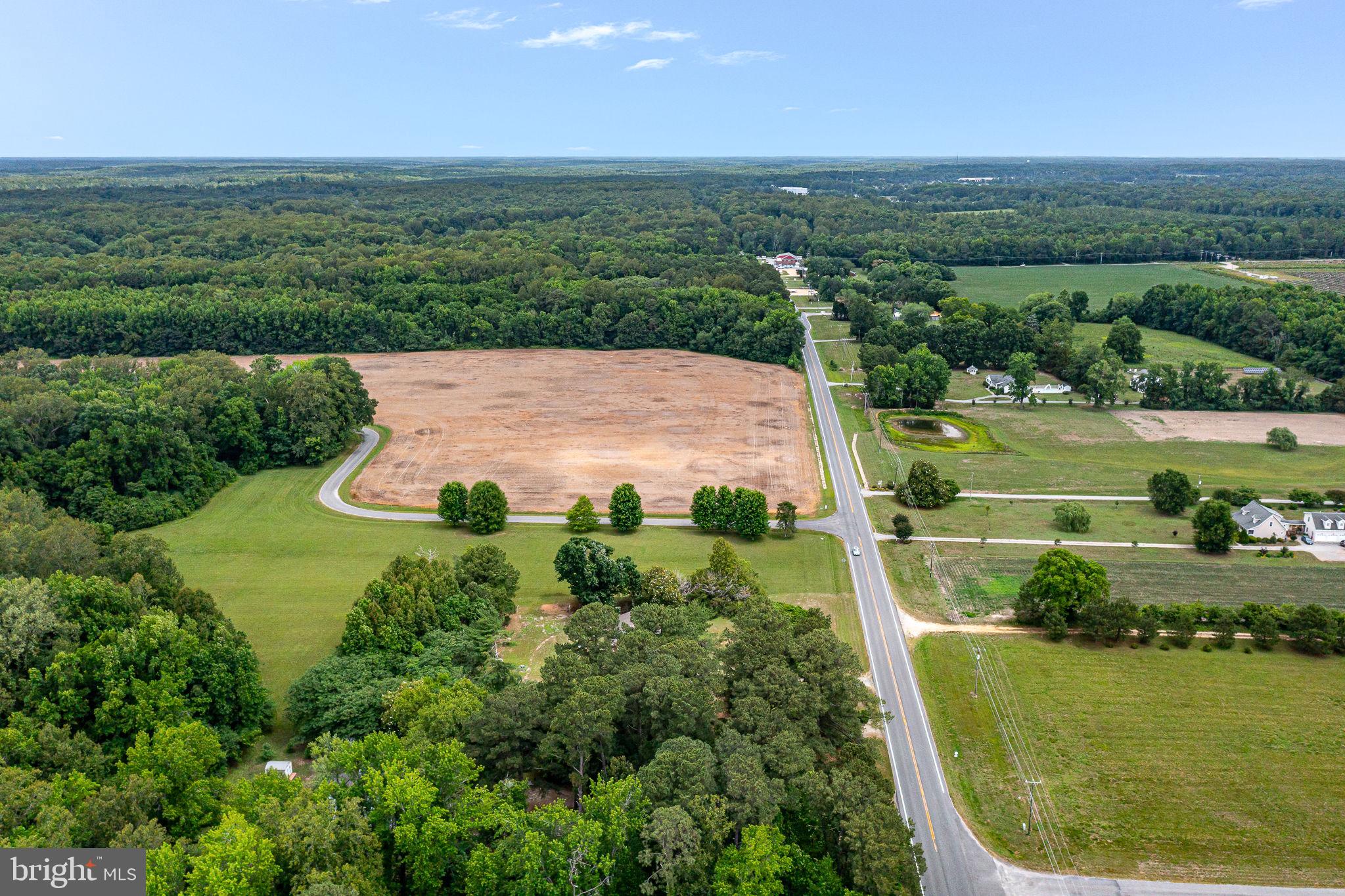 3952 Irvington Road Irvington, VA 22480 - Photo 52 of 77 an aerial view of a house with a garden
