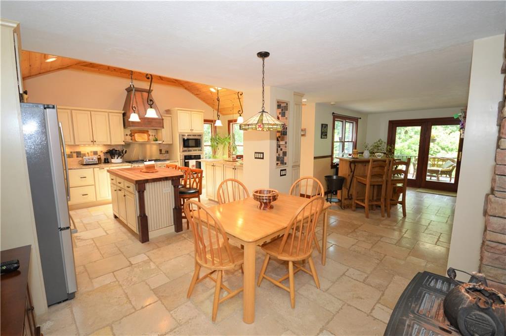 285 Ridge Road Valencia, PA 16059 - Photo 7 of 25 kitchen and dining area ceramic floors open floor plan off of Family room and deck overlooking Pool
