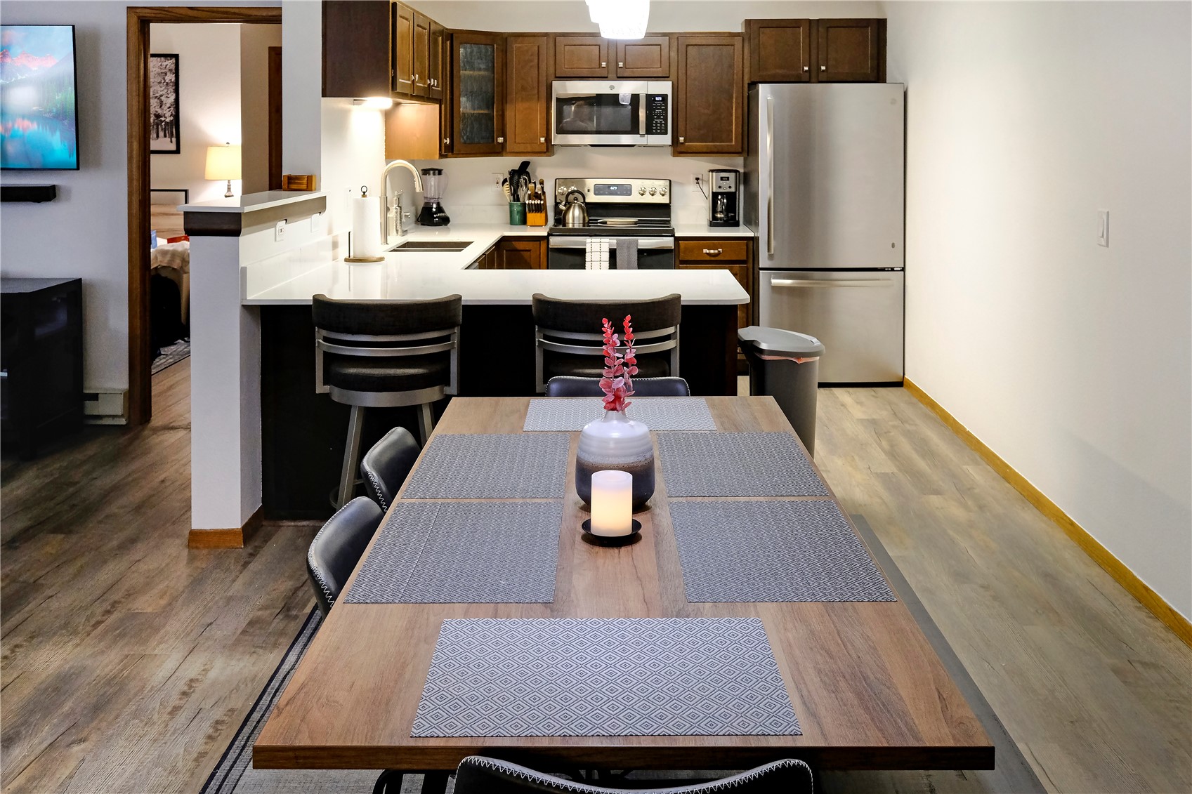 23034 Highway 6, Unit 305 Keystone, CO 80435 - Photo 8 of 27 a kitchen with a table chairs and refrigerator