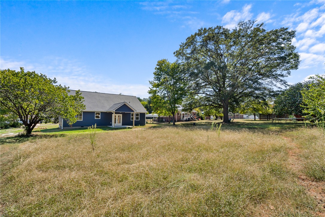 1507 Tindall Avenue Anderson, SC 29621 - Photo 34 of 38 A spacious grassy yard frames this classic home bordered by mature shade trees.