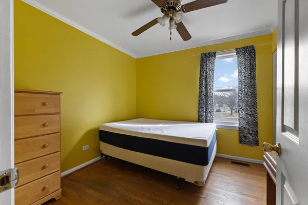 a bed room with a bed and a window