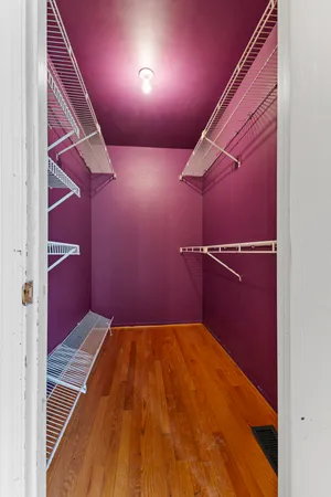 a view of an empty room with racks on the wall