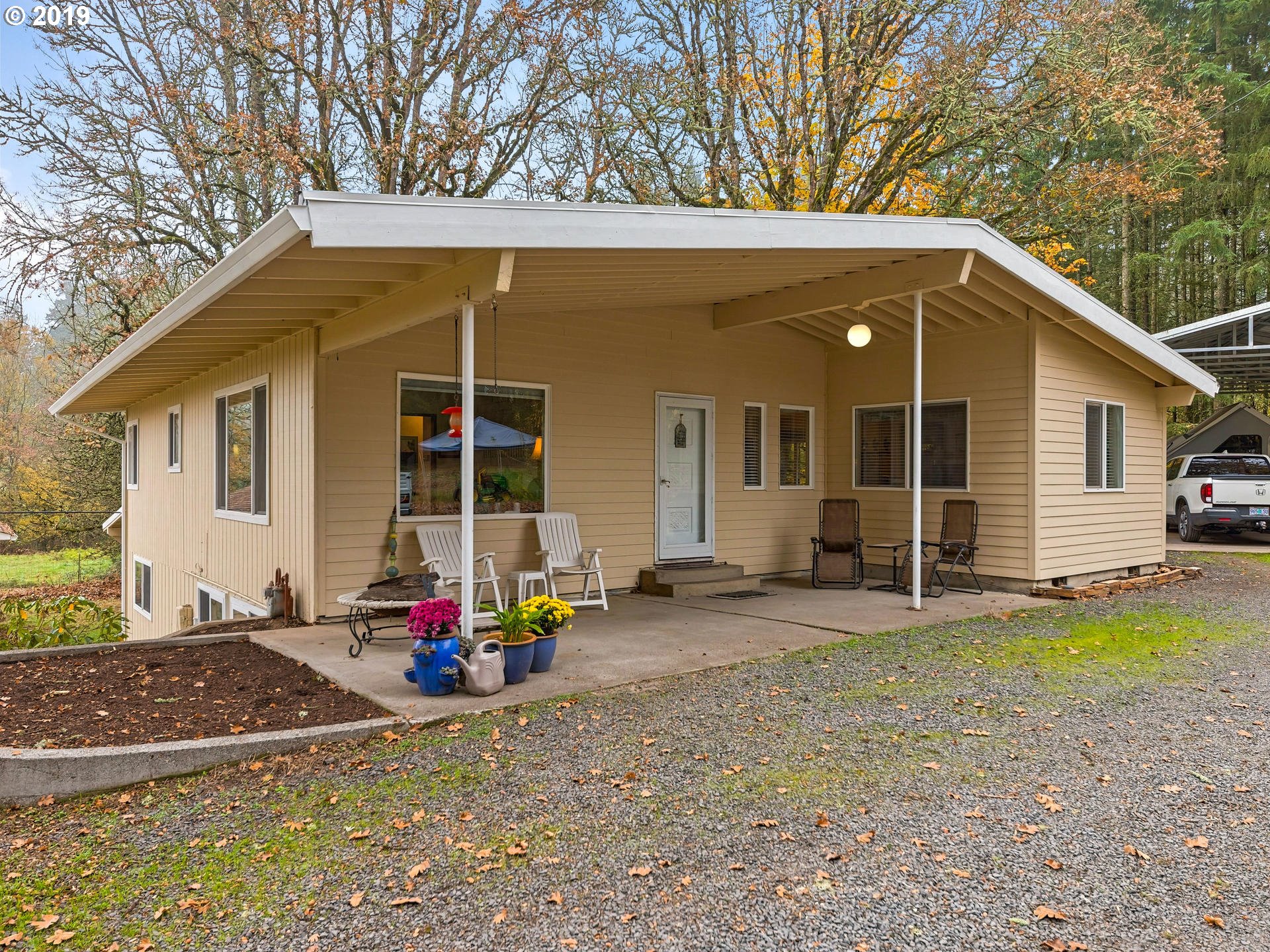 21390 Southwest Farmington Road Beaverton, OR 97007 - Photo 1 of 25 a backyard of a house with seating space and porch area