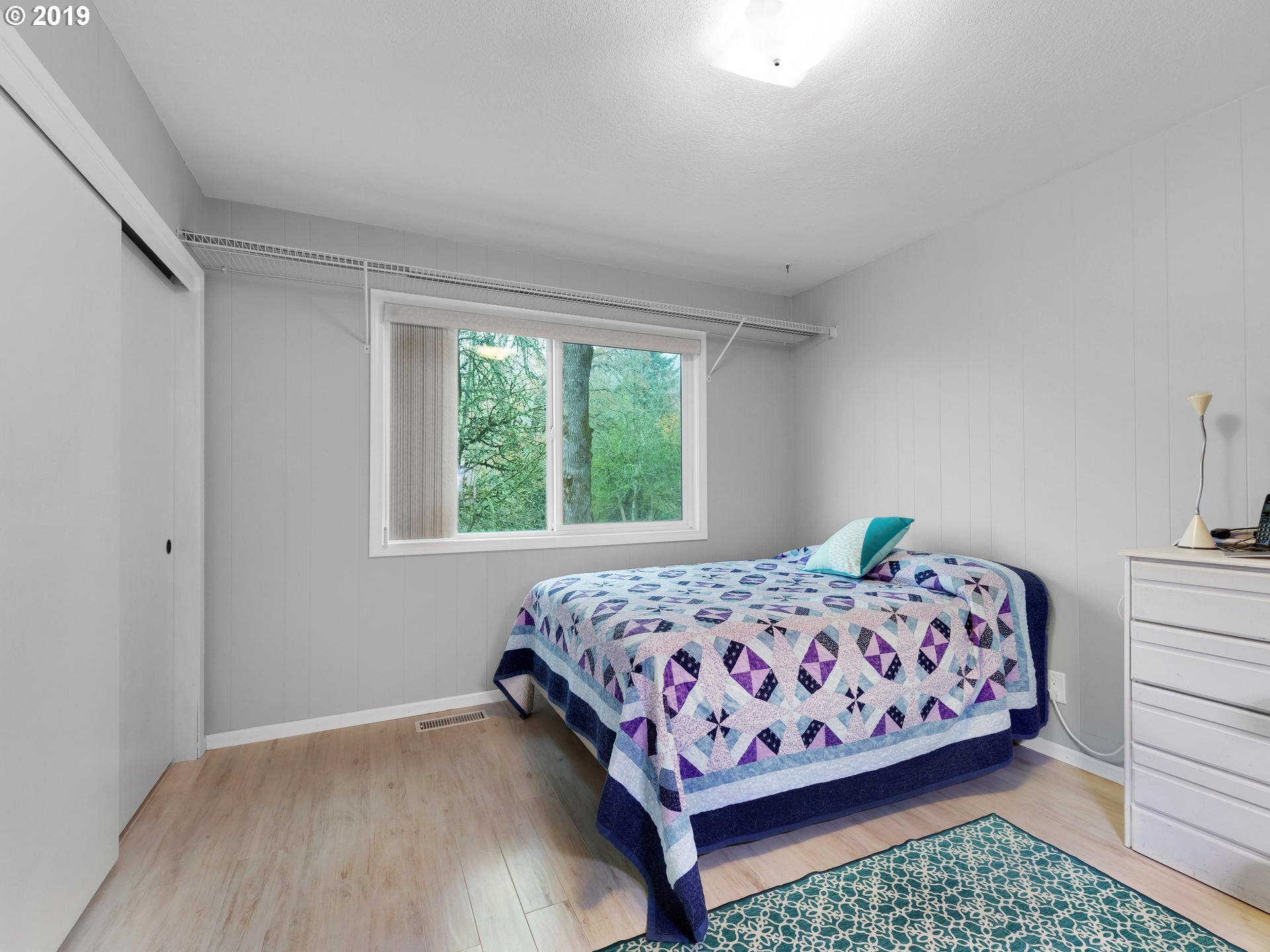 21390 Southwest Farmington Road Beaverton, OR 97007 - Photo 12 of 25 a bedroom with a bed and a window