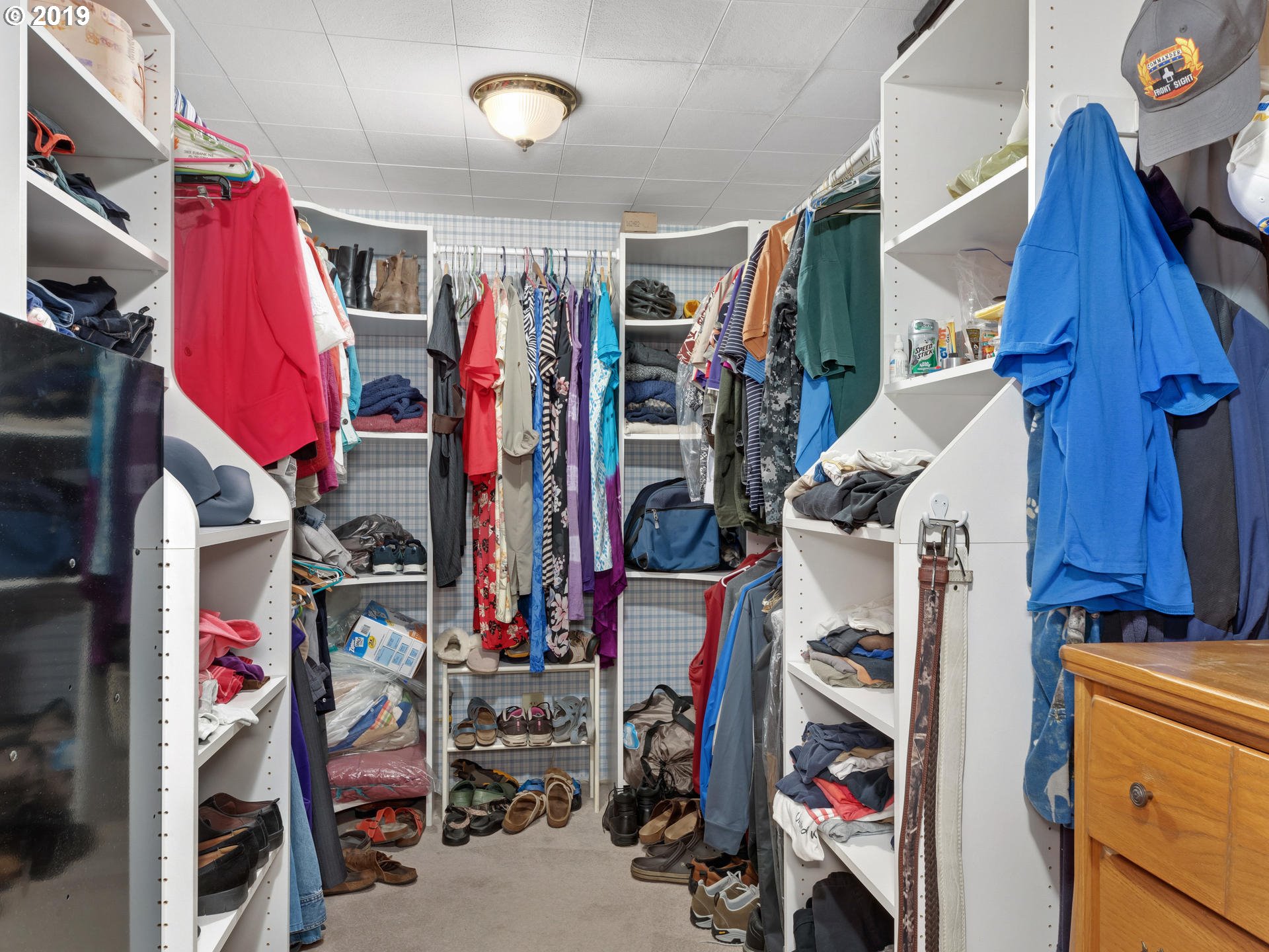 21390 Southwest Farmington Road Beaverton, OR 97007 - Photo 16 of 25 a view of walk in closet with clothes and shoes