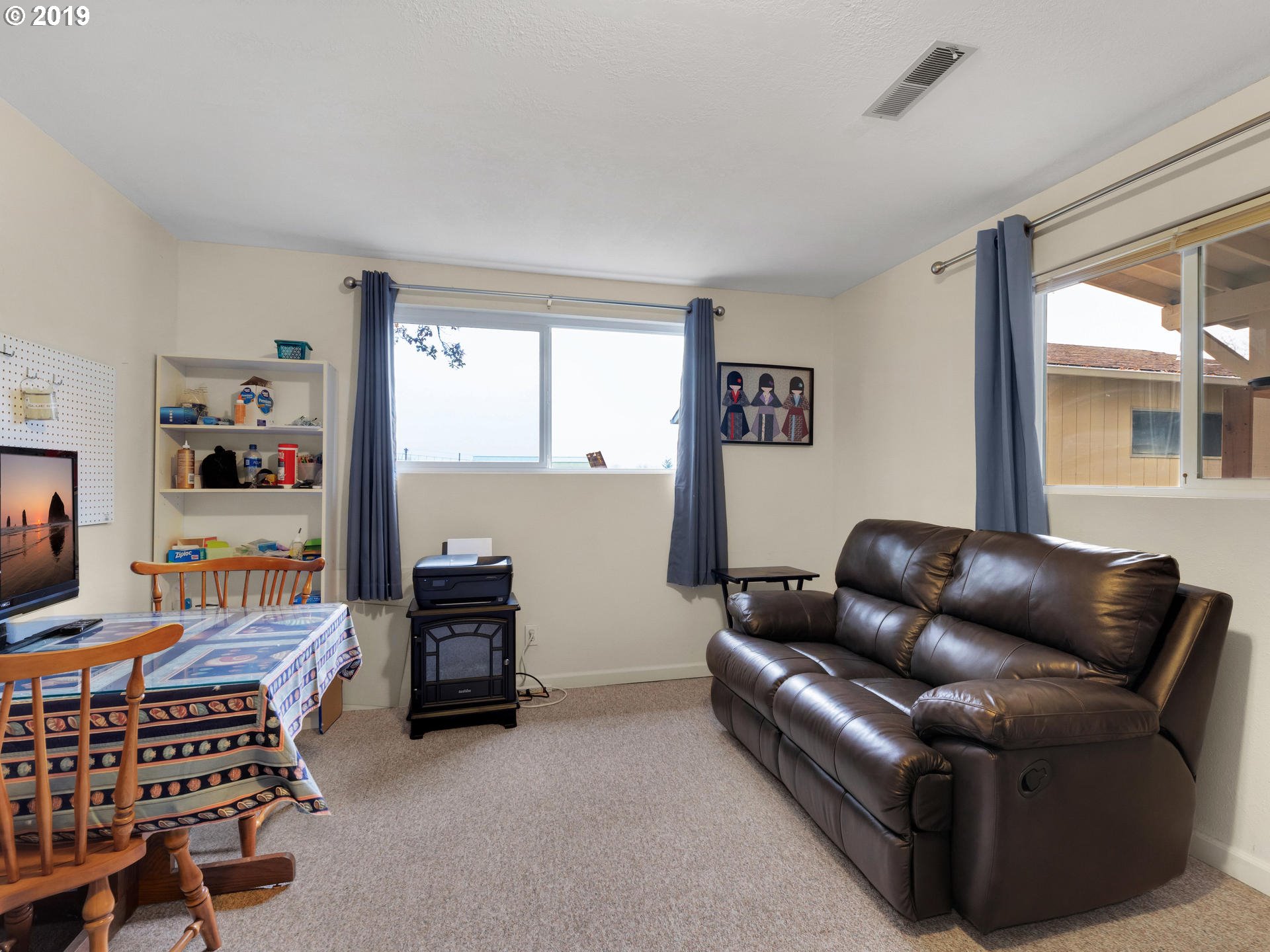21390 Southwest Farmington Road Beaverton, OR 97007 - Photo 17 of 25 a living room with furniture and a window