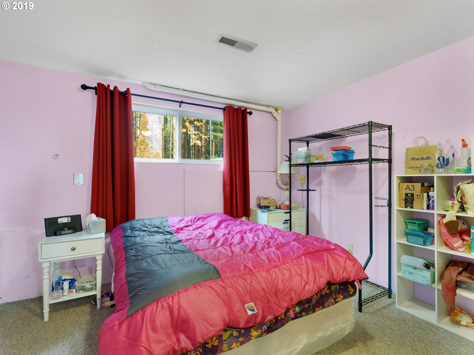 21390 Southwest Farmington Road Beaverton, OR 97007 - Photo 18 of 25 a bed room with a bed and a window