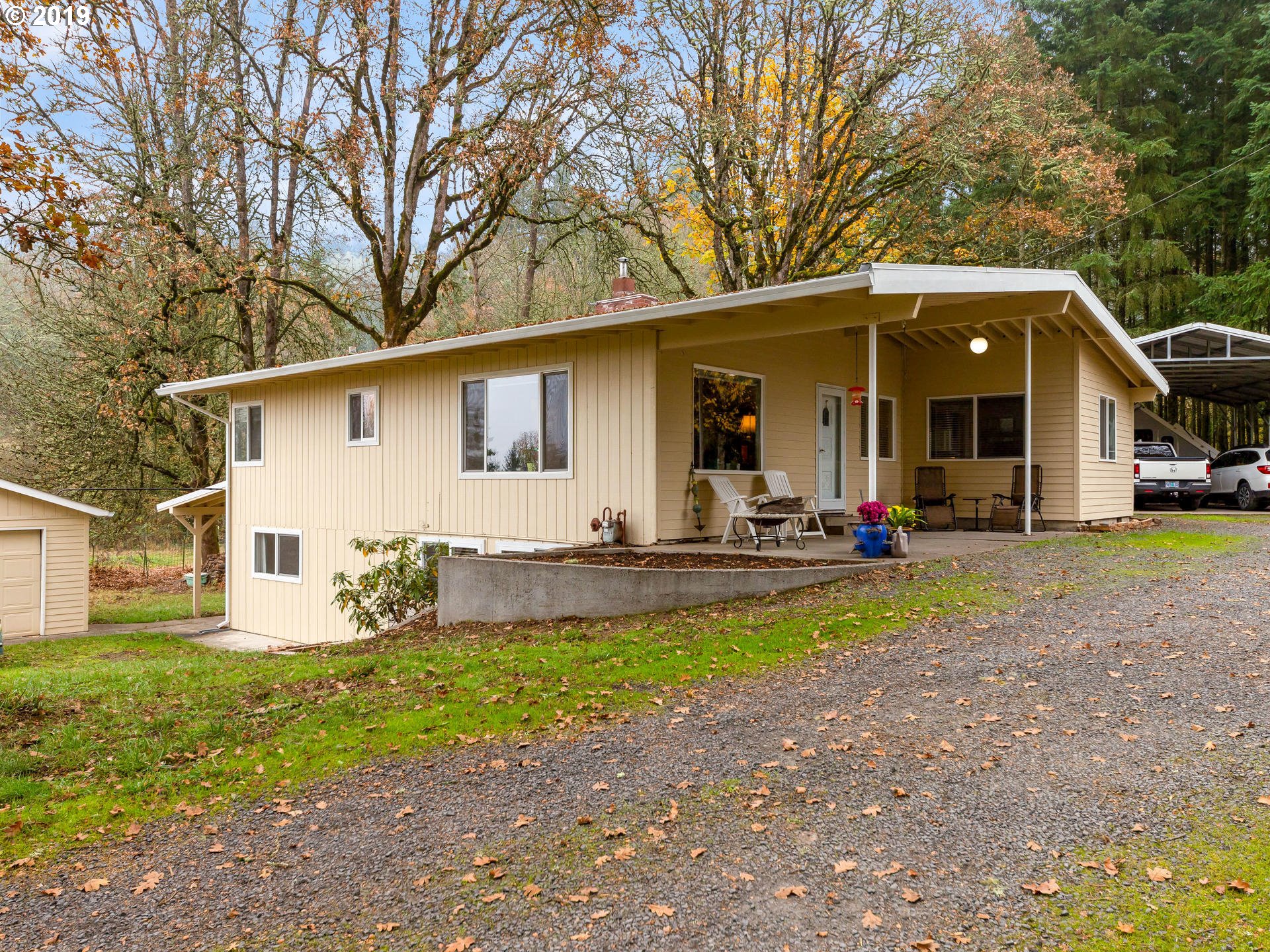 21390 Southwest Farmington Road Beaverton, OR 97007 - Photo 2 of 25 a view of a house with backyard and a tree