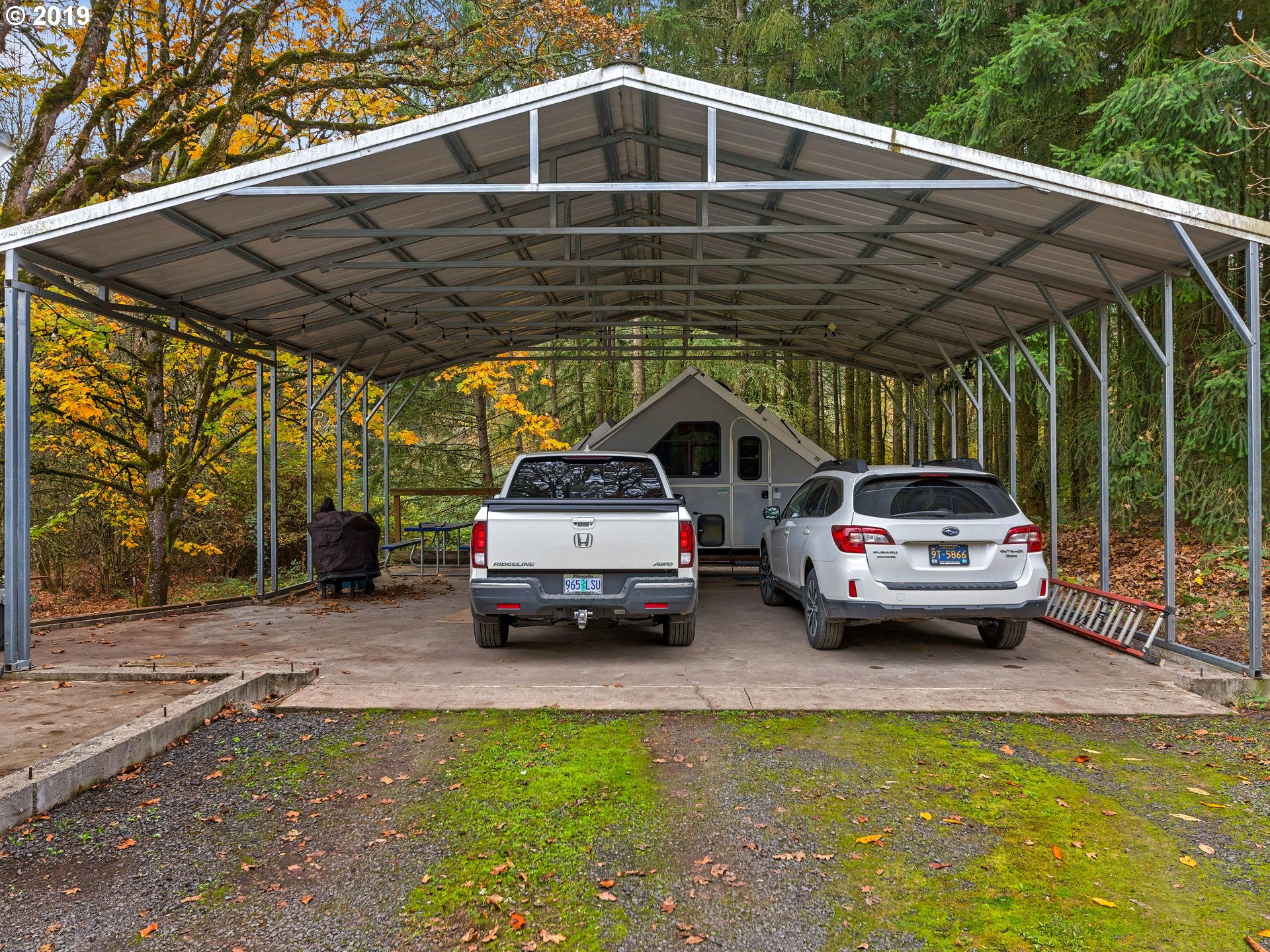 21390 Southwest Farmington Road Beaverton, OR 97007 - Photo 4 of 25 a view of car parked in parking lot of a house