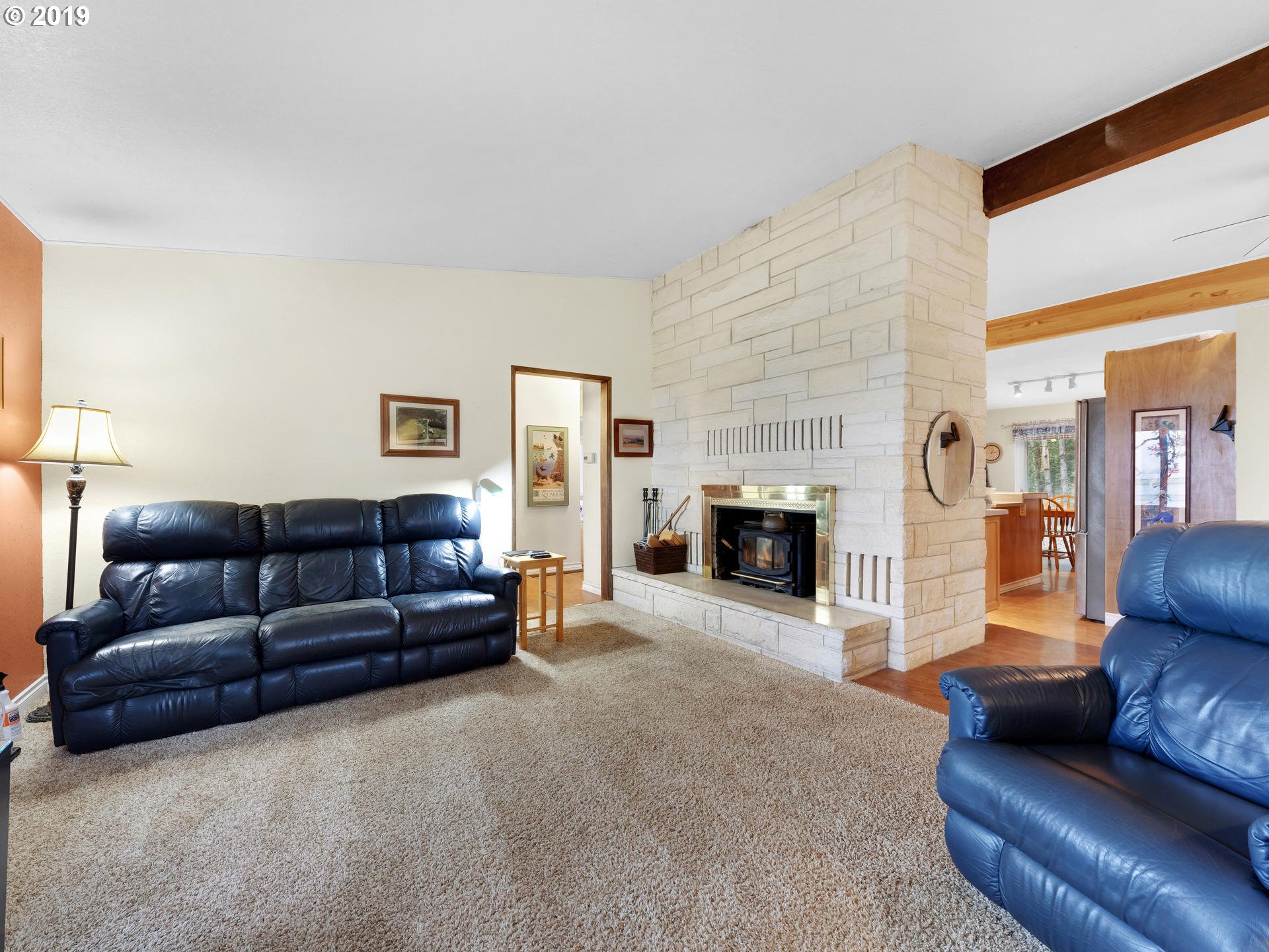 21390 Southwest Farmington Road Beaverton, OR 97007 - Photo 6 of 25 a living room with furniture and a fireplace