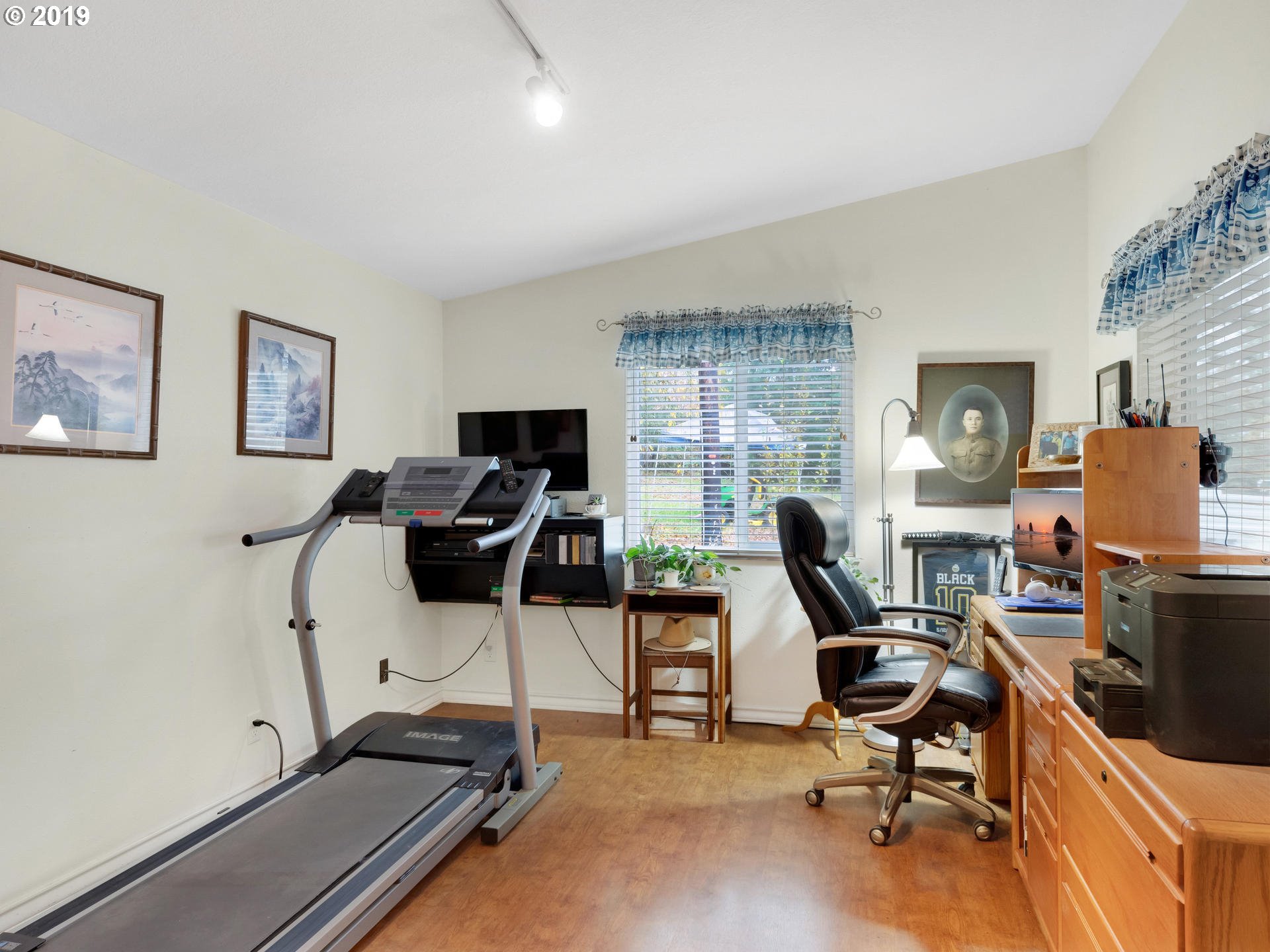 21390 Southwest Farmington Road Beaverton, OR 97007 - Photo 9 of 25 a view of a workspace with furniture and a window