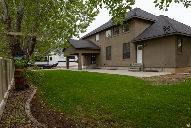3565 West 1350th Street North Vernal, UT 84078 - Photo 51 of 54 Expansive green lawn with a stucco exterior