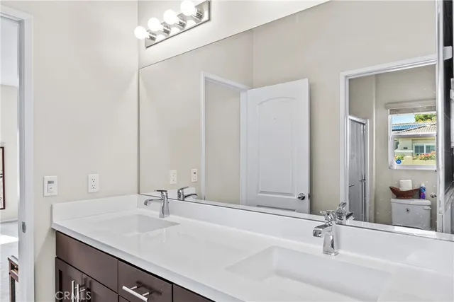 a bathroom with a sink and a large mirror