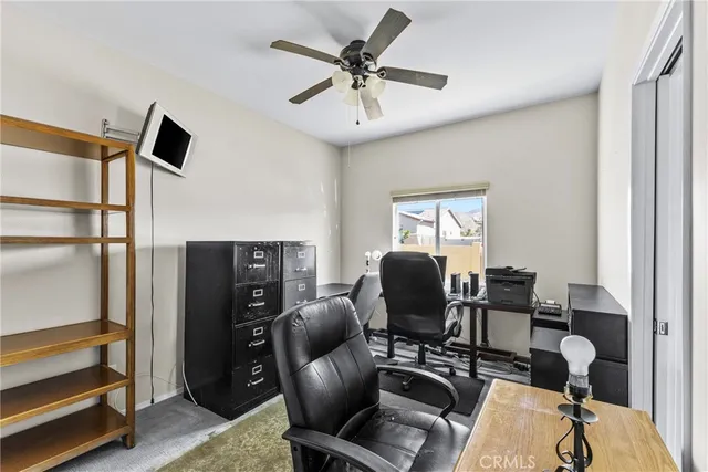 a work room with furniture and windows