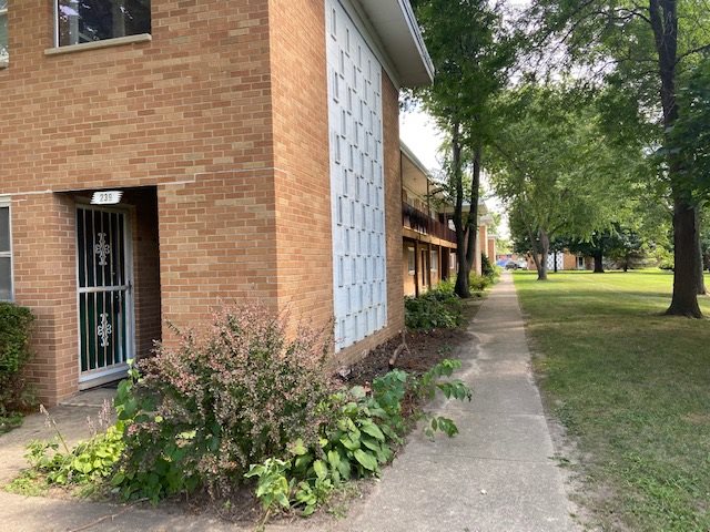 239 Northway Park Road Machesney Park, IL 61115 - Photo 2 of 14 a pathway of a house with a yard
