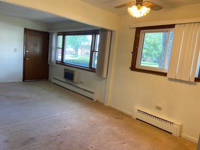 239 Northway Park Road Machesney Park, IL 61115 - Photo 6 of 14 an empty room with windows
