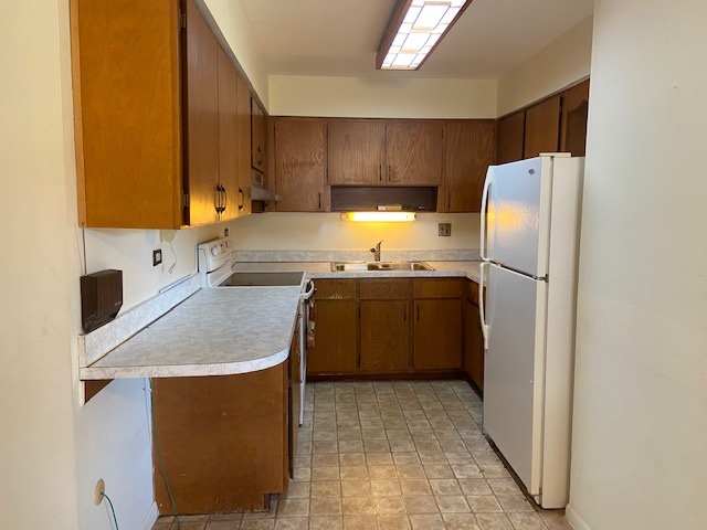 239 Northway Park Road Machesney Park, IL 61115 - Photo 7 of 14 a kitchen with stainless steel appliances granite countertop a sink a stove a refrigerator a washer dryer and white cabinets
