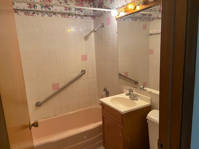 239 Northway Park Road Machesney Park, IL 61115 - Photo 10 of 14 a bathroom with a sink a mirror and a shower