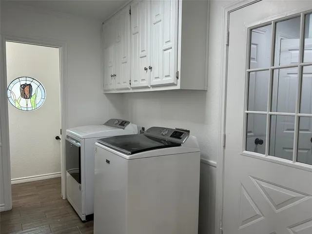 a kitchen with stainless steel appliances granite countertop a stove and a refrigerator