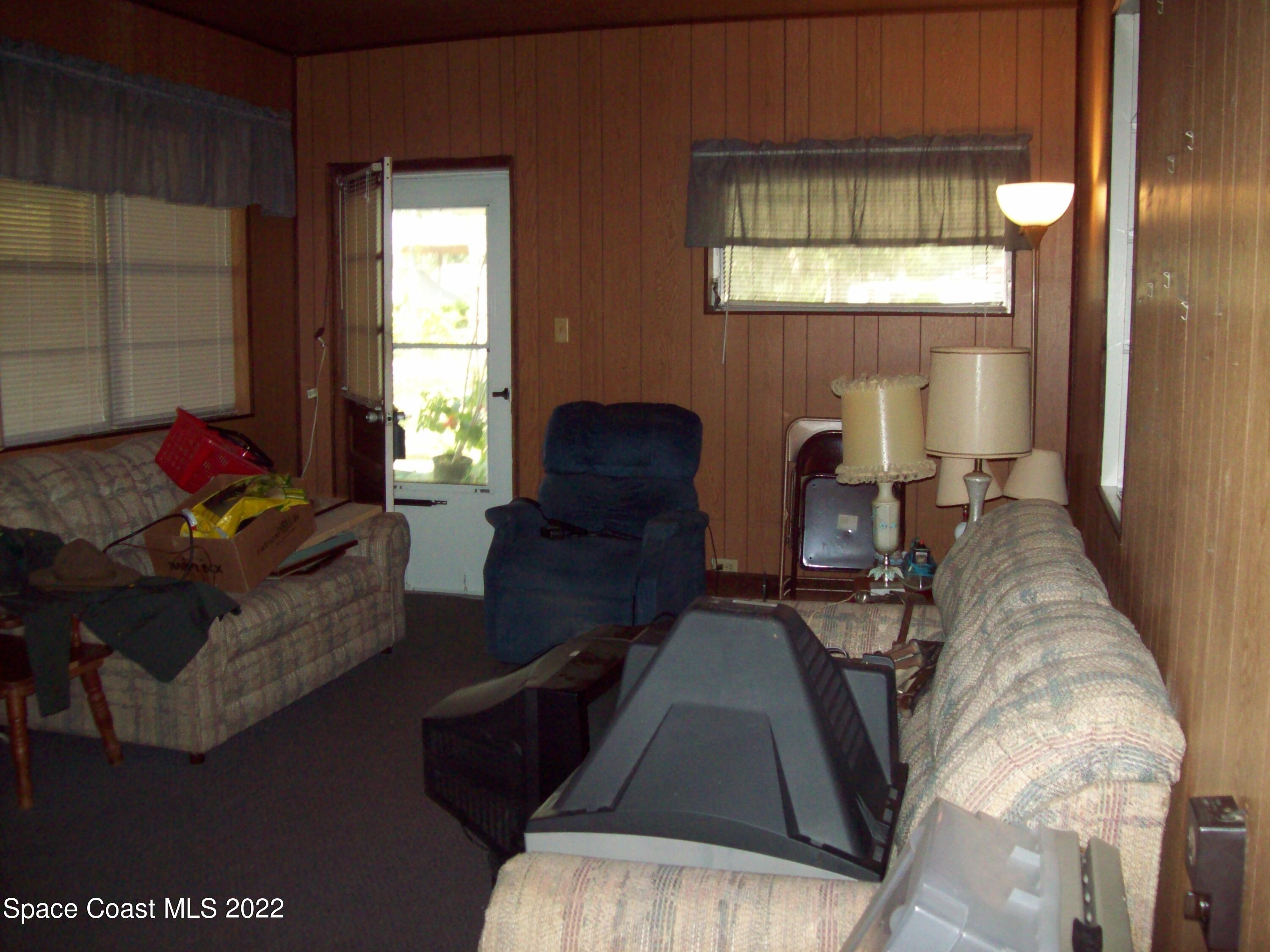 2224 Iowa Street Melbourne, FL 32904 - Photo 11 of 19 a living room with furniture and a large window