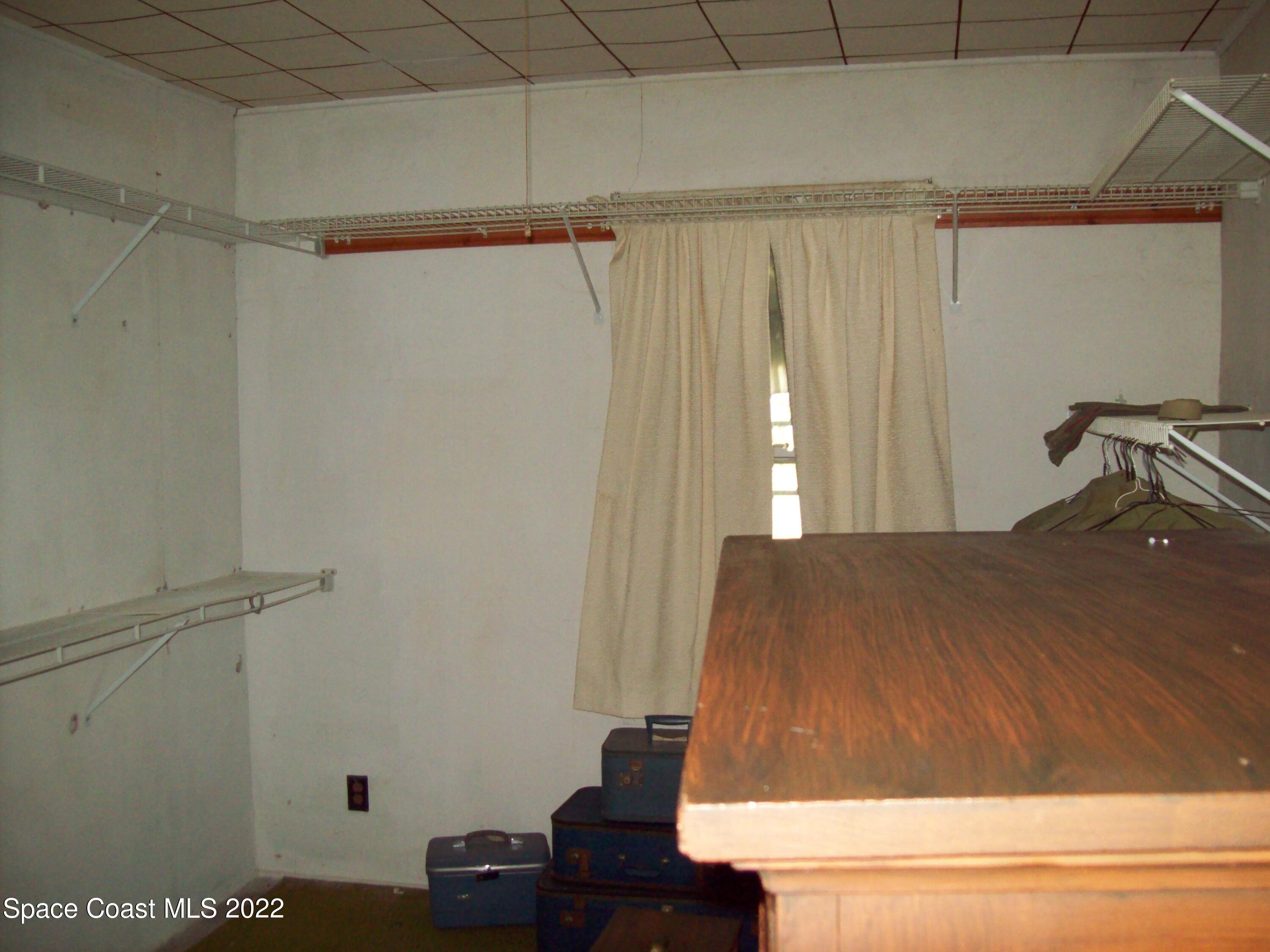 2224 Iowa Street Melbourne, FL 32904 - Photo 13 of 19 a room with a bed and a window