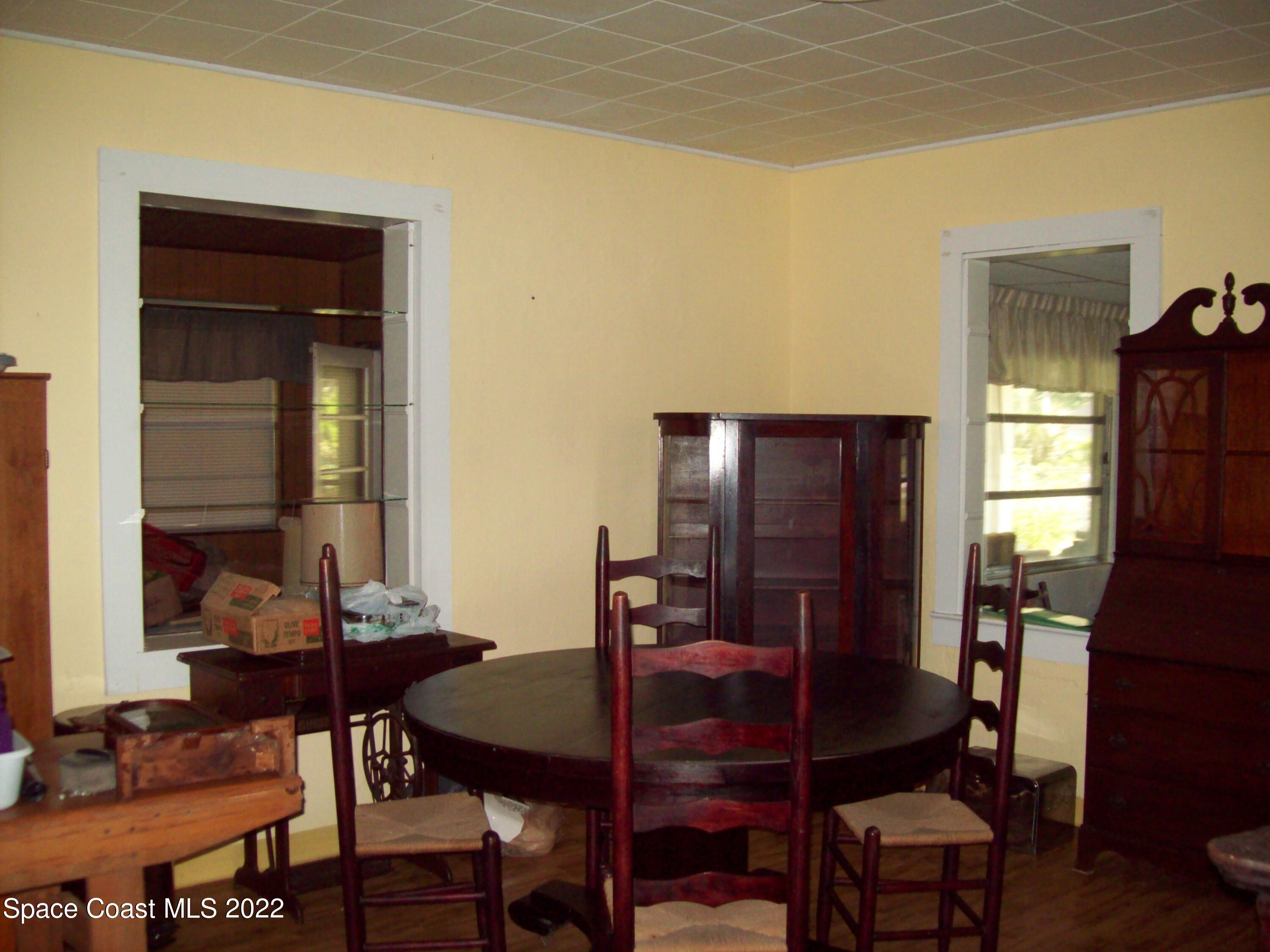 2224 Iowa Street Melbourne, FL 32904 - Photo 16 of 19 a dining room with furniture and window