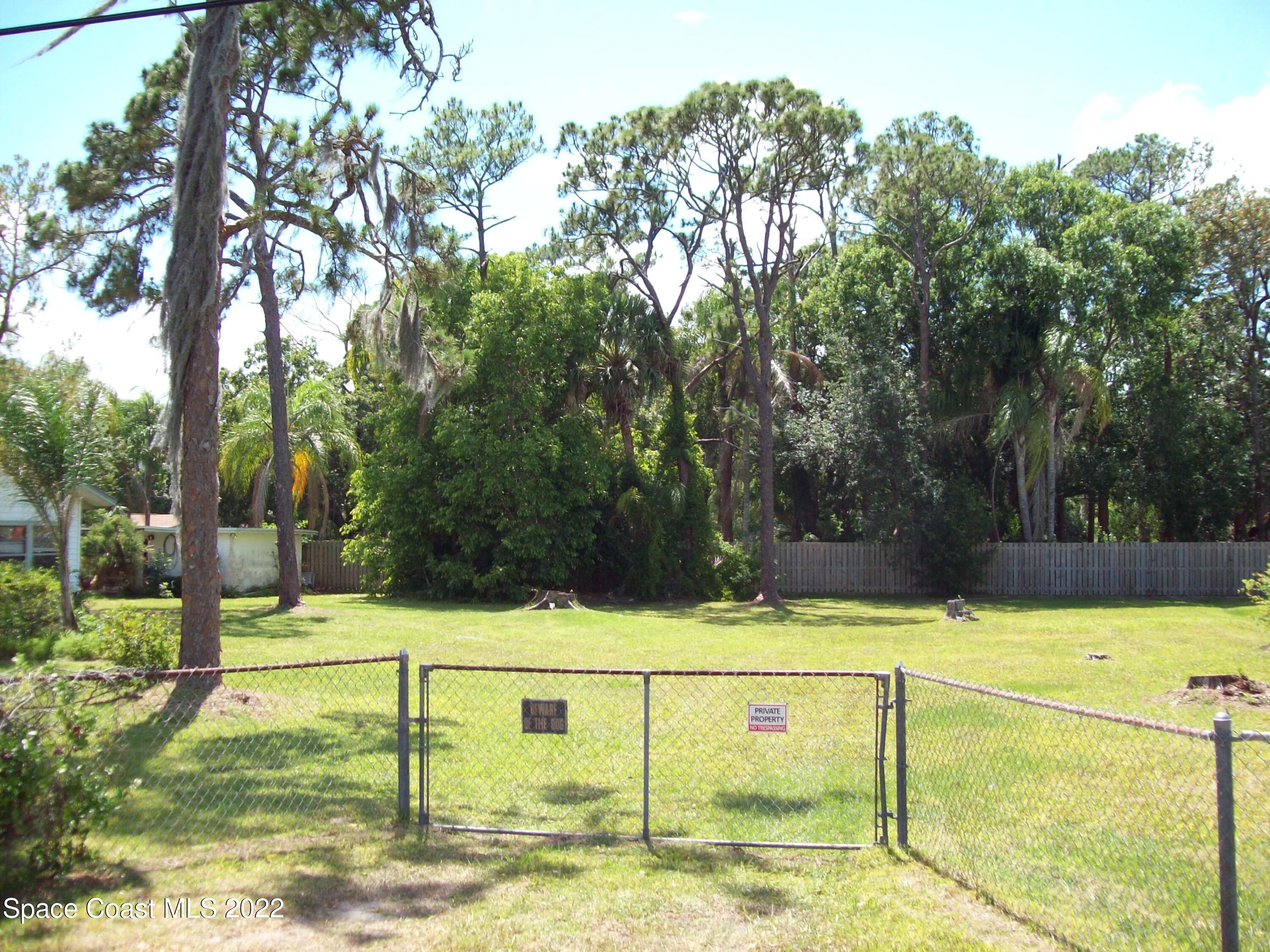 2224 Iowa Street Melbourne, FL 32904 - Photo 18 of 19 a view of a yard with large trees