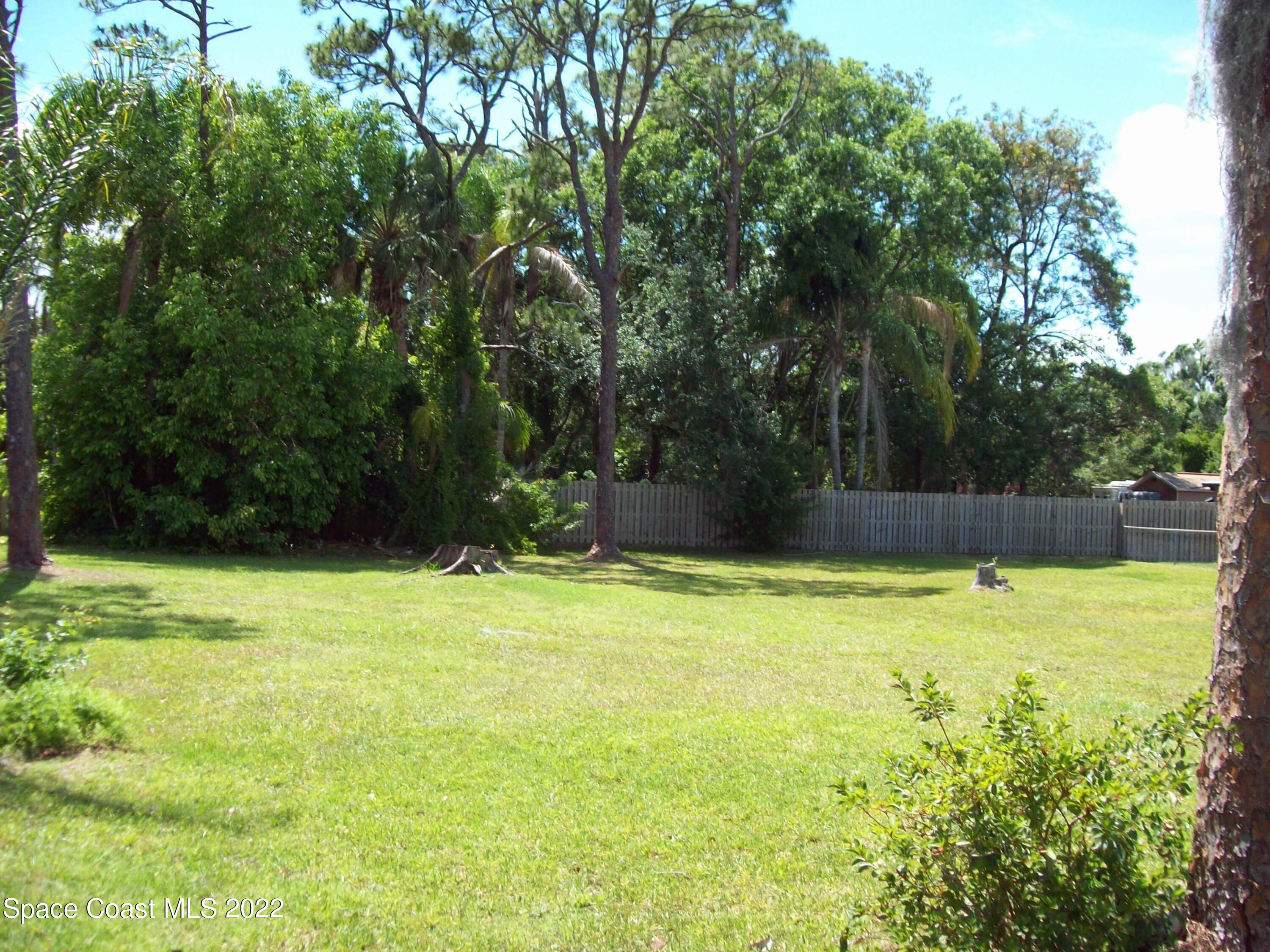 2224 Iowa Street Melbourne, FL 32904 - Photo 3 of 19 a view of a yard with a trees